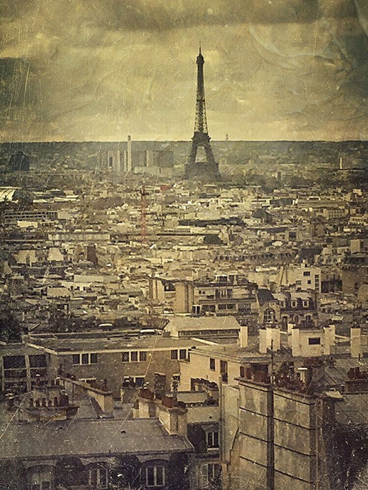 aerial view of the city  
Eiffel Tower at the horizon