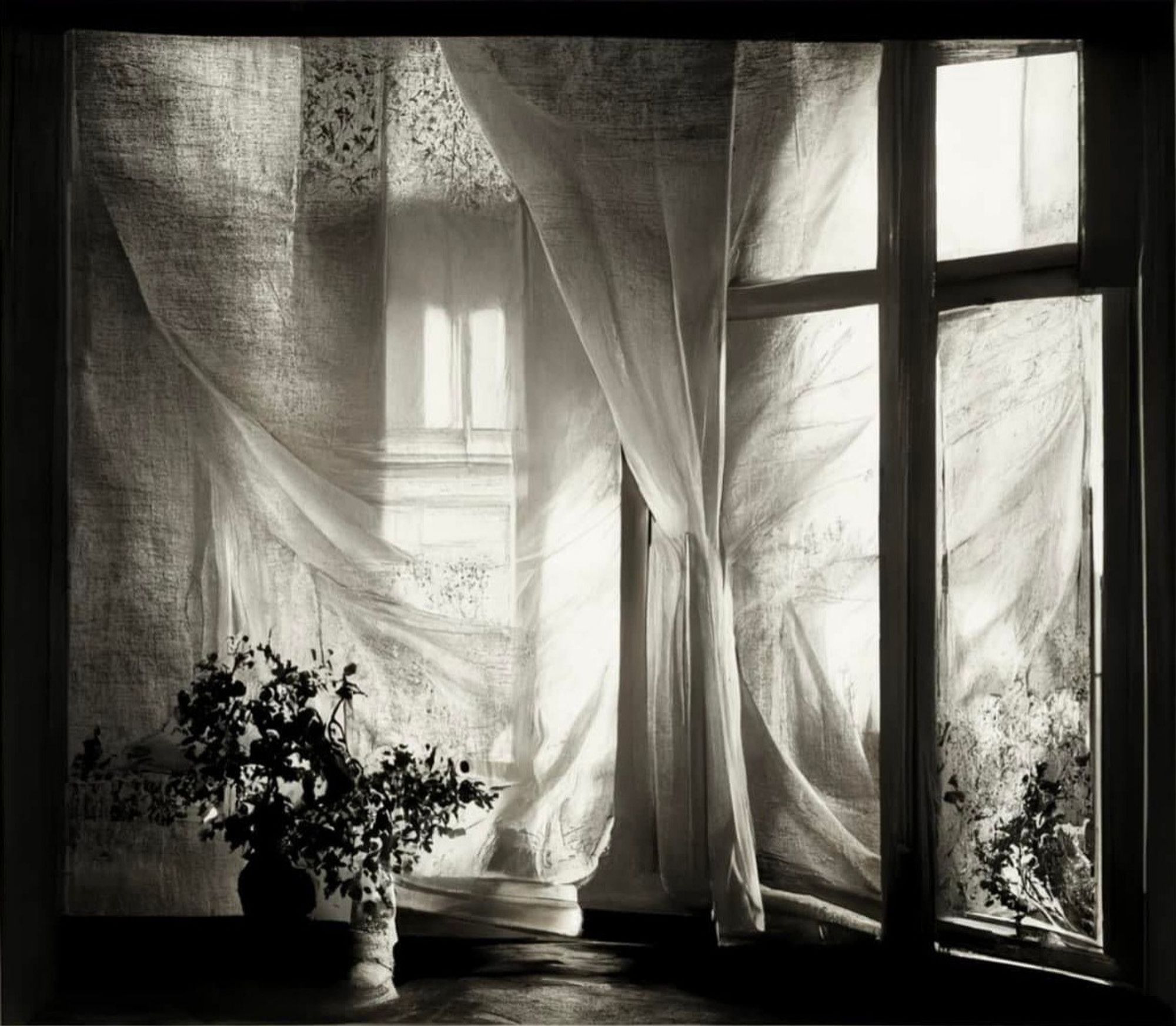 Soft morning light through sheer curtains, table with flowers