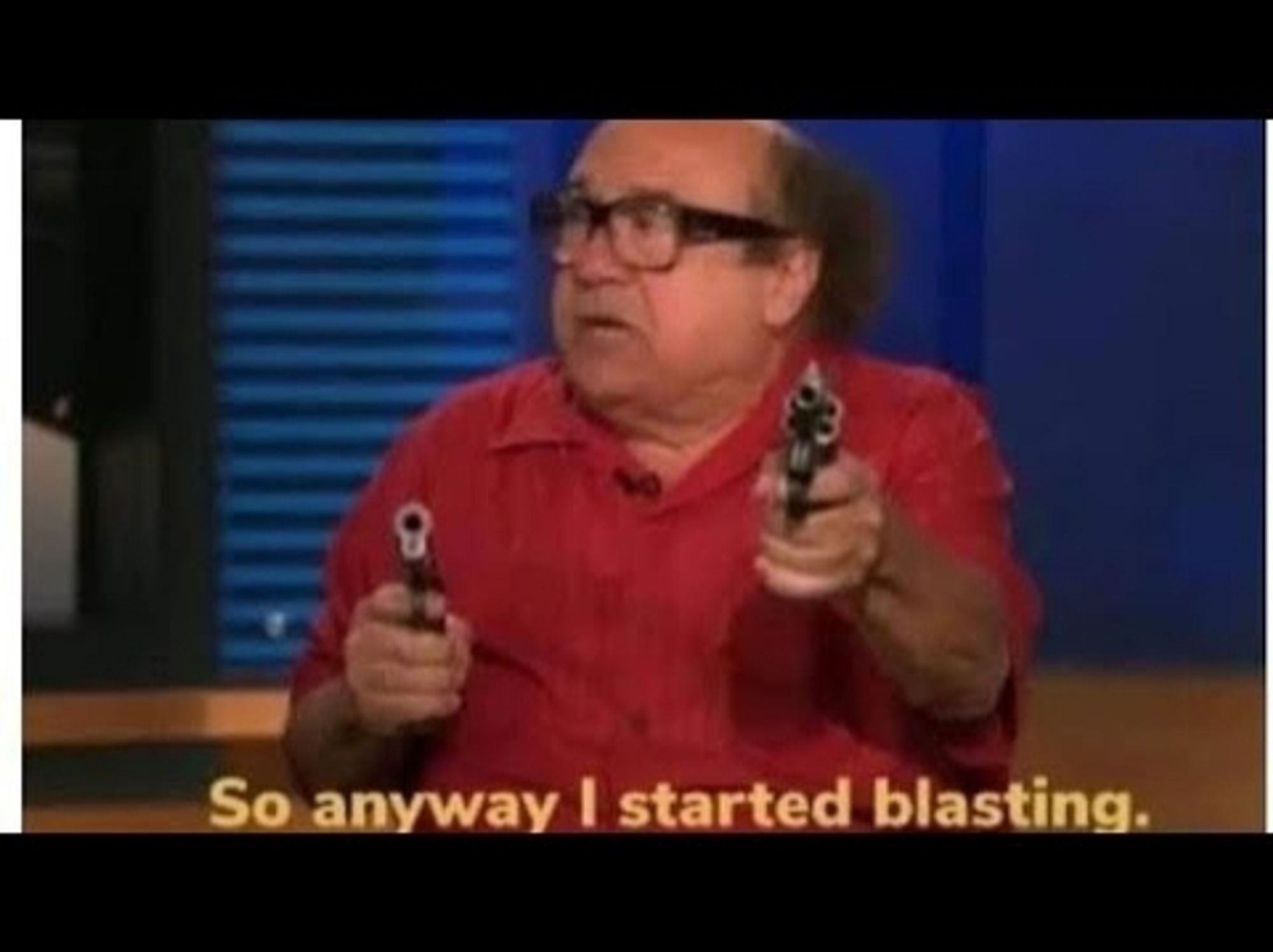 Danny DeVito holding two guns, captioned "so anyway I started blasting"