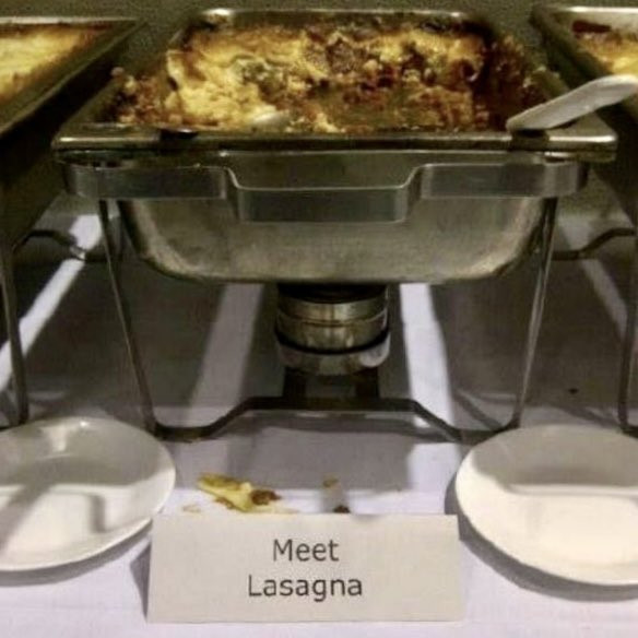 Chafing dish with a card labeling it "Meet Lasagna."