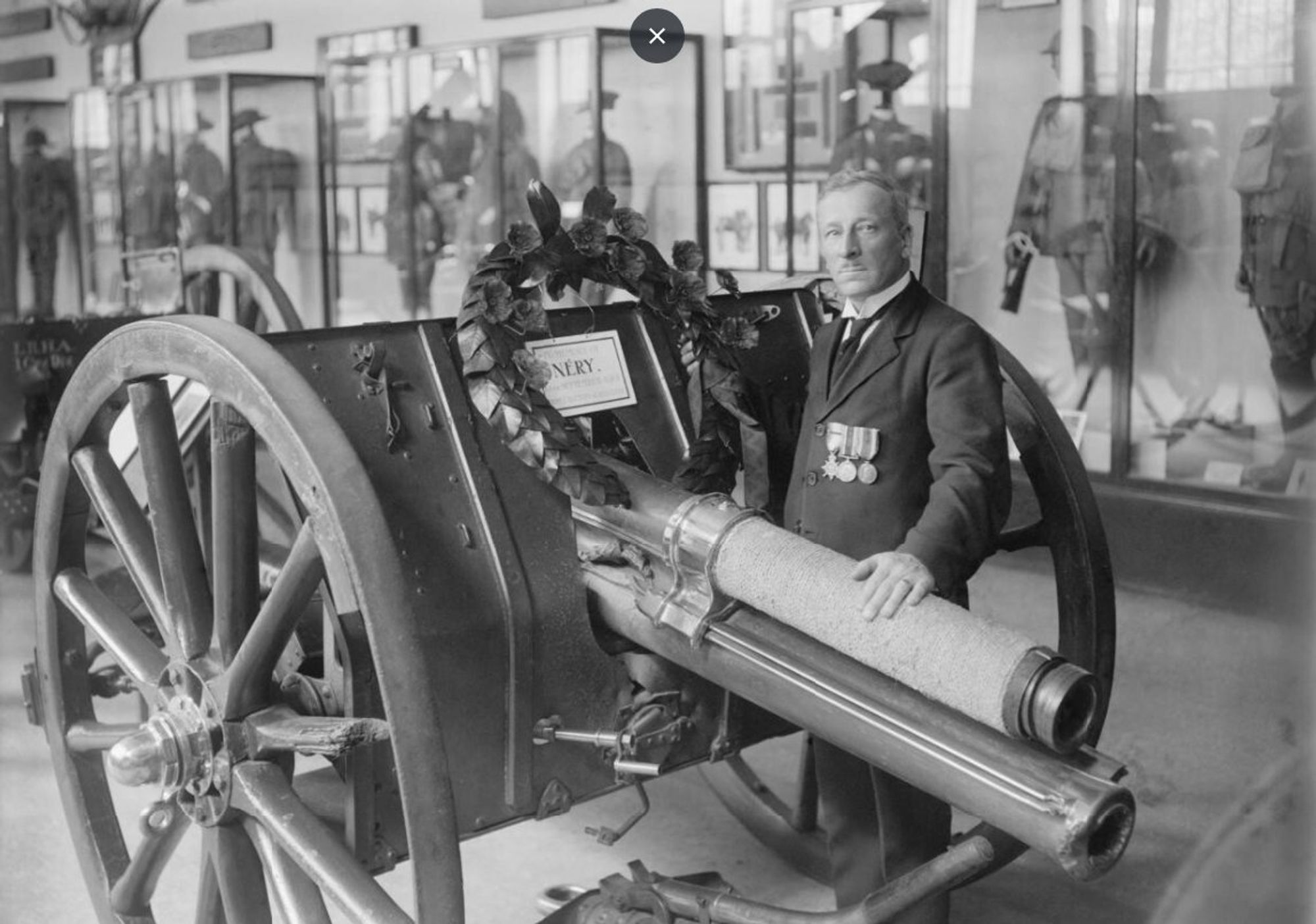 A man stands with the Nery Gun in the Imperial War Museum, 1926. Q 44245