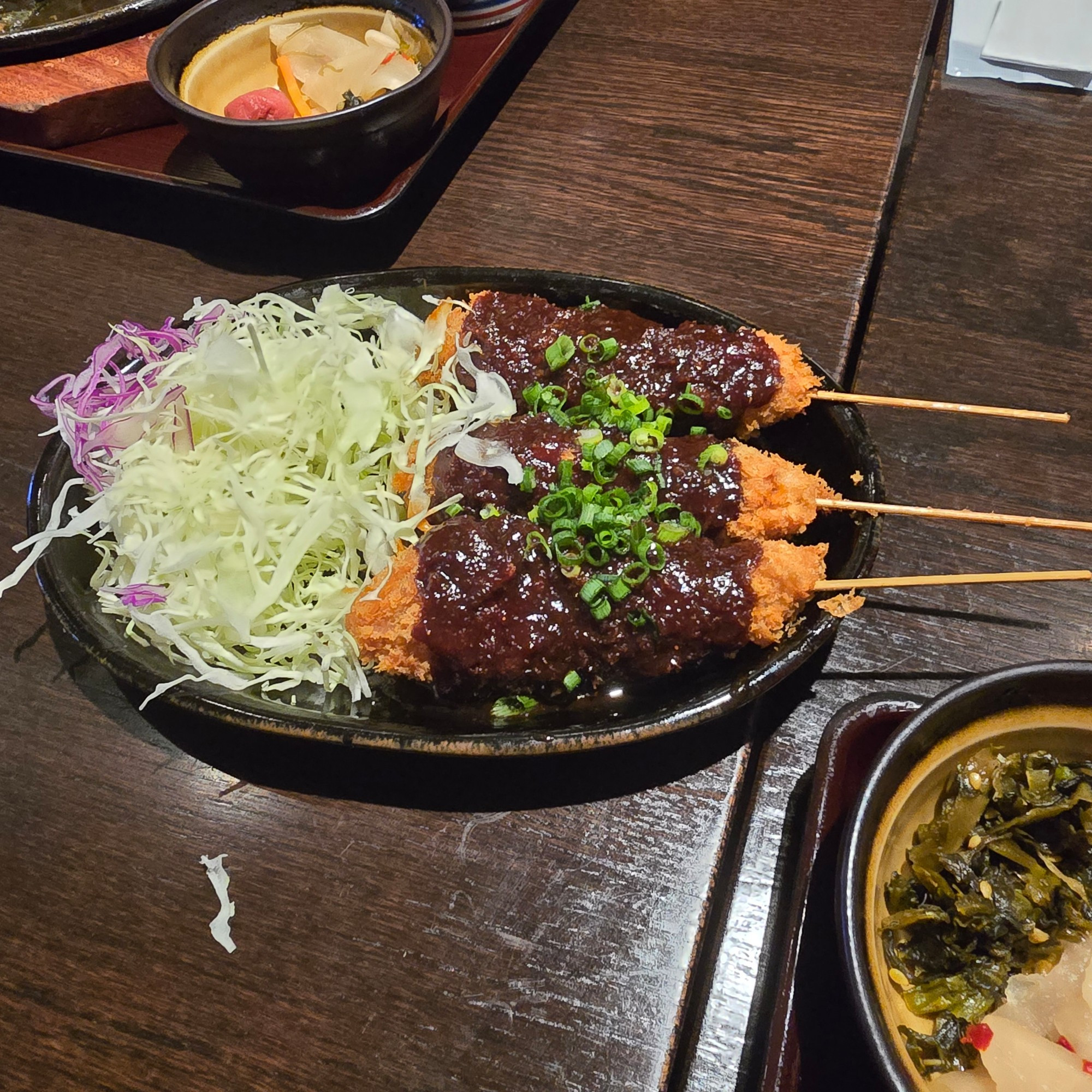 I forget what it is called. They are meat mince fried with an external batter and on sticks. Came with a savory sauce and cabbage. 