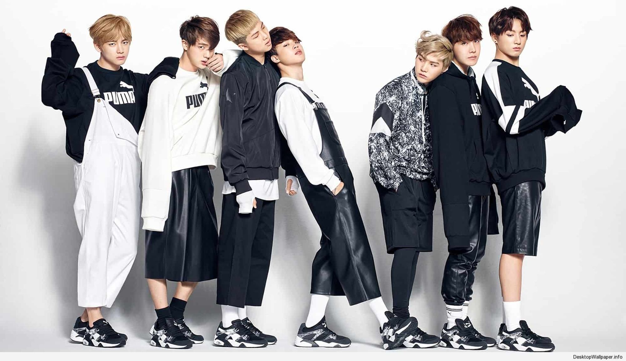 bts ot7 standing in a line for in highcut magazine wearing puma and also a lot of too-long shirts and too-short pants. things are made of pleather that shouldn't be made of pleather. yoongi's hair is styled in a delightful anime swoop.