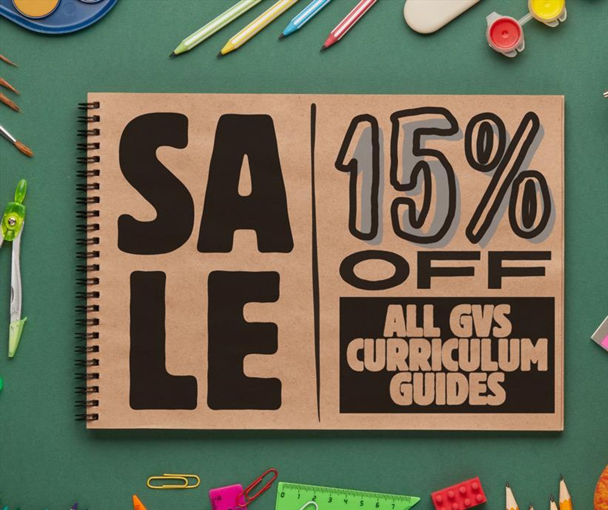 Flash Sale graphic:

Spiral bound notebook with craft paper pages on a green tabletop surrounded by pencils, watercolor tools and the like.

Text on notebook reads:

"SALE 15% OFF all GVS Curriculum Guides"