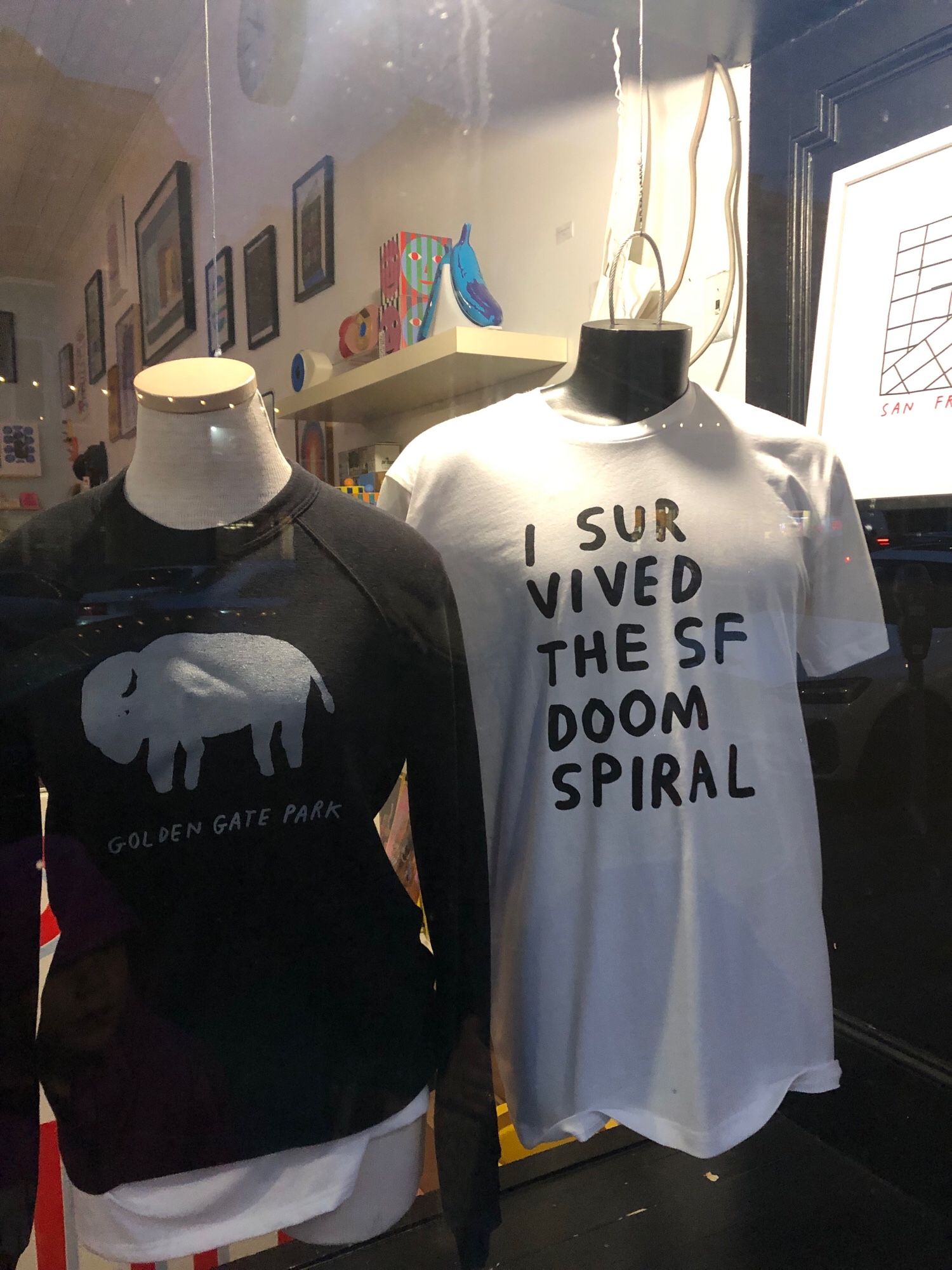 T shirt that reads “I survived the SF doom spiral”