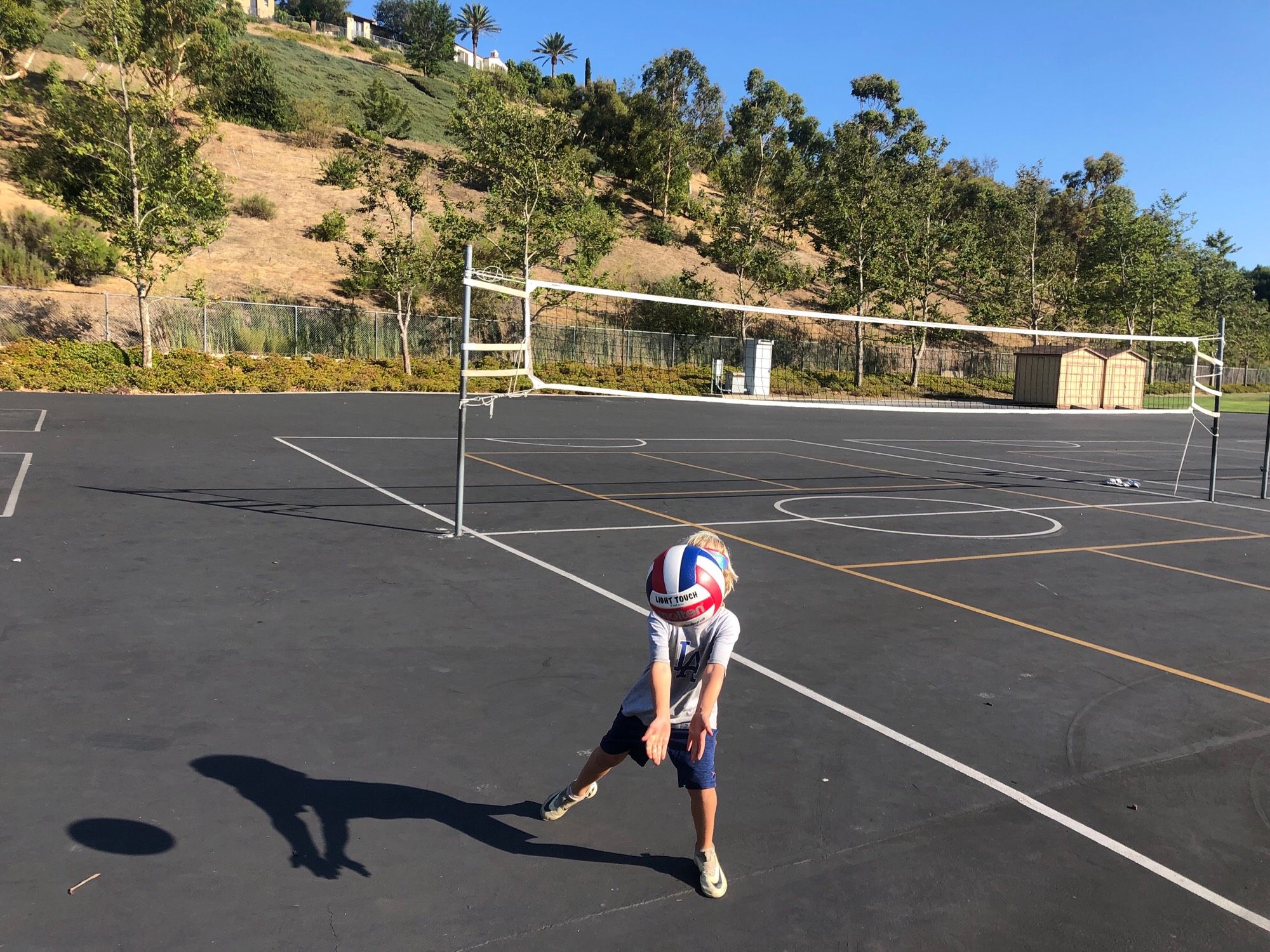 Kid playing volleyball