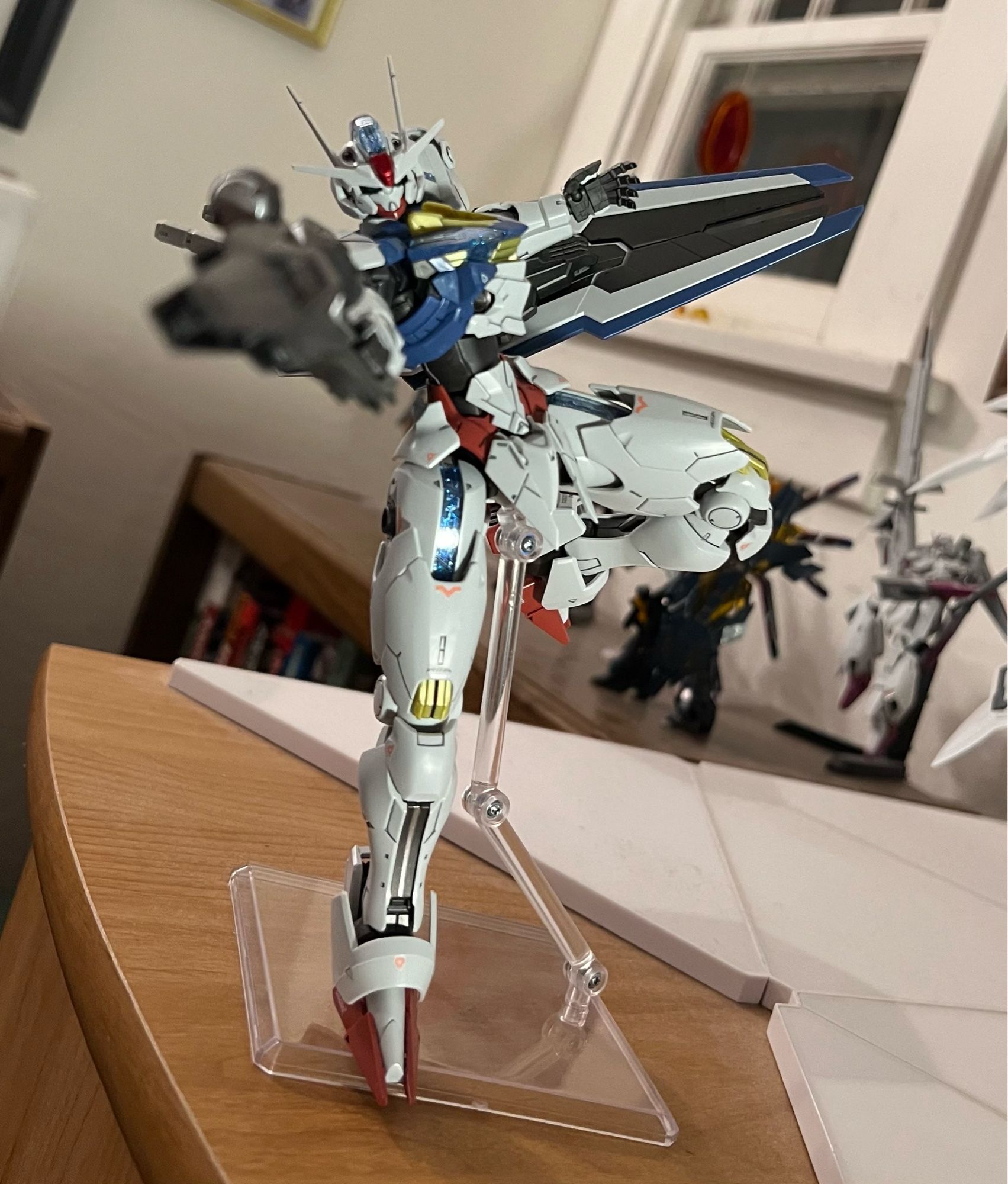 A gunpla model of Gundam Aerial in a shooting pose