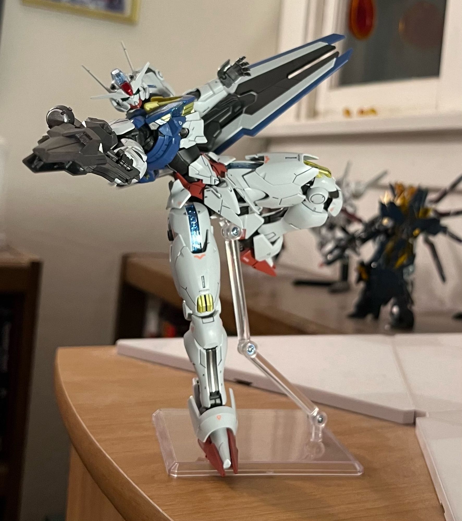 A gunpla model of Gundam Aerial in a shooting pose