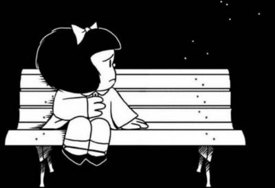 Black and white drawing of Mafalda sitting alone on the left side of a white bench, on a black background, looking to the empty seat next to her, reaching it with her hand, with a sad look on her face. There are a few white dots floating above where another person would be sitting.