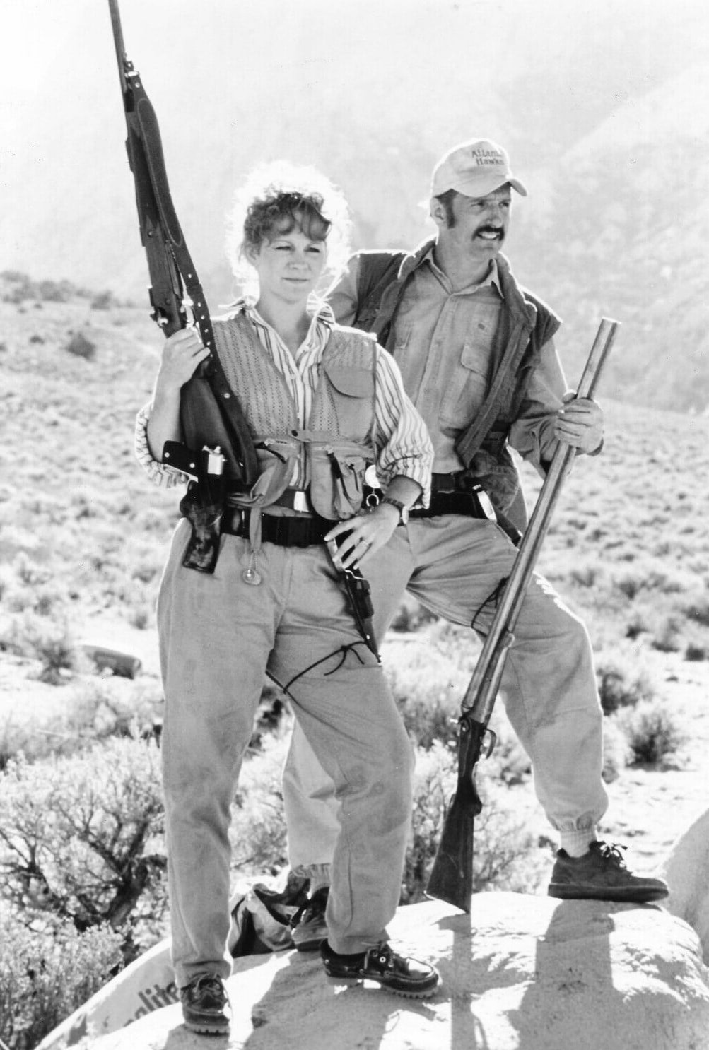 Reba mcentire and Michael Gross in tremors in black and white