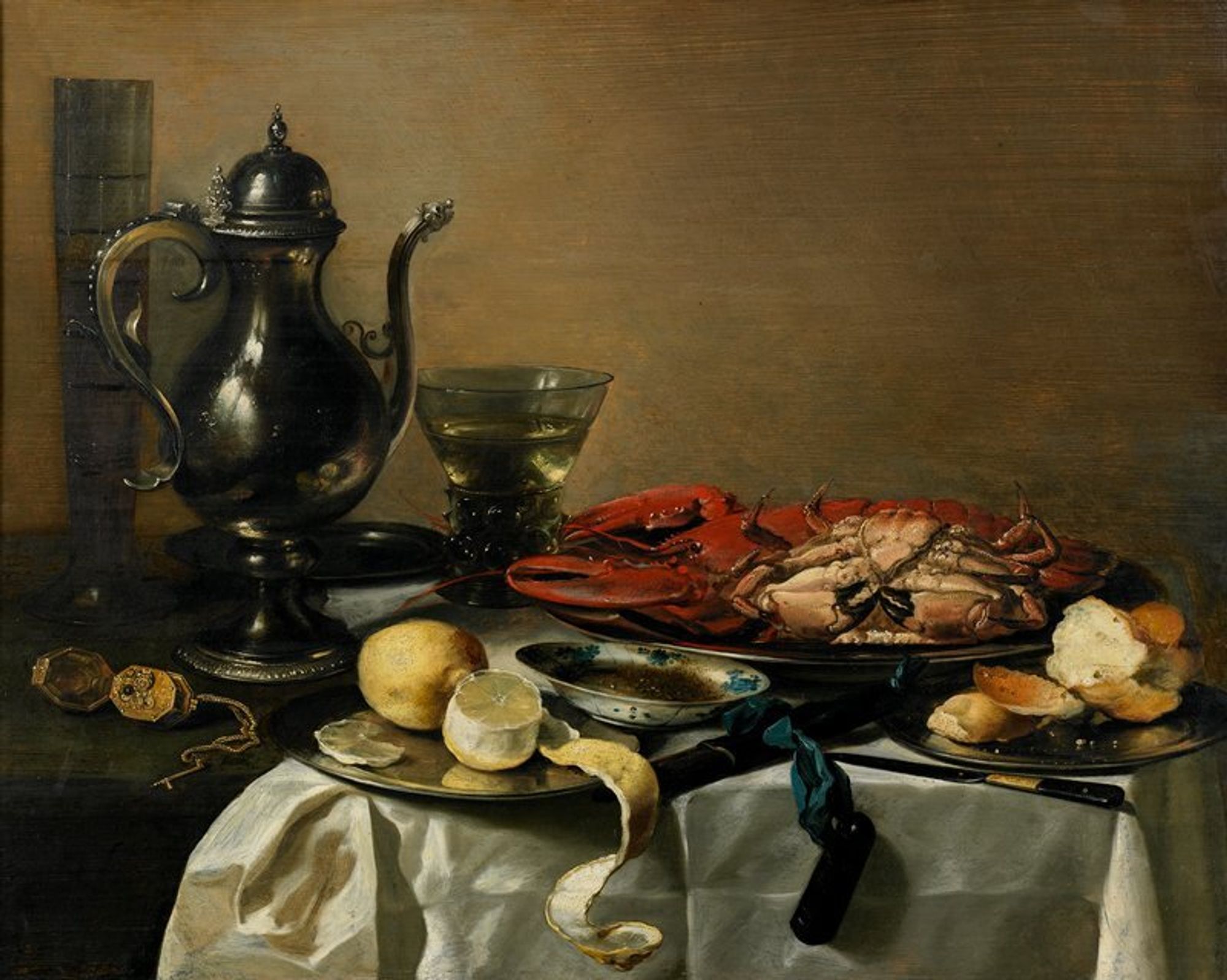 Dutch Golden Age. 'Vanitas' still life.
Claesz was one of the most important Dutch still-life painters of the 1600s, depicting objects with an extraordinary sense of naturalism. Everything on the table, from the fluted glass and goblet to the lobster and crab, is indeed life-like. You can almost smell the lemons. The Dutch proudly displayed such expensive status symbols in their homes, the exotic food and material possessions reminding them of the good things in life, even as the watch reminds them of their transience. The bread and wine, in a touch of Christian symbolism, echo the moralizing message of vanitas, or vanity: all earthly things must pass.