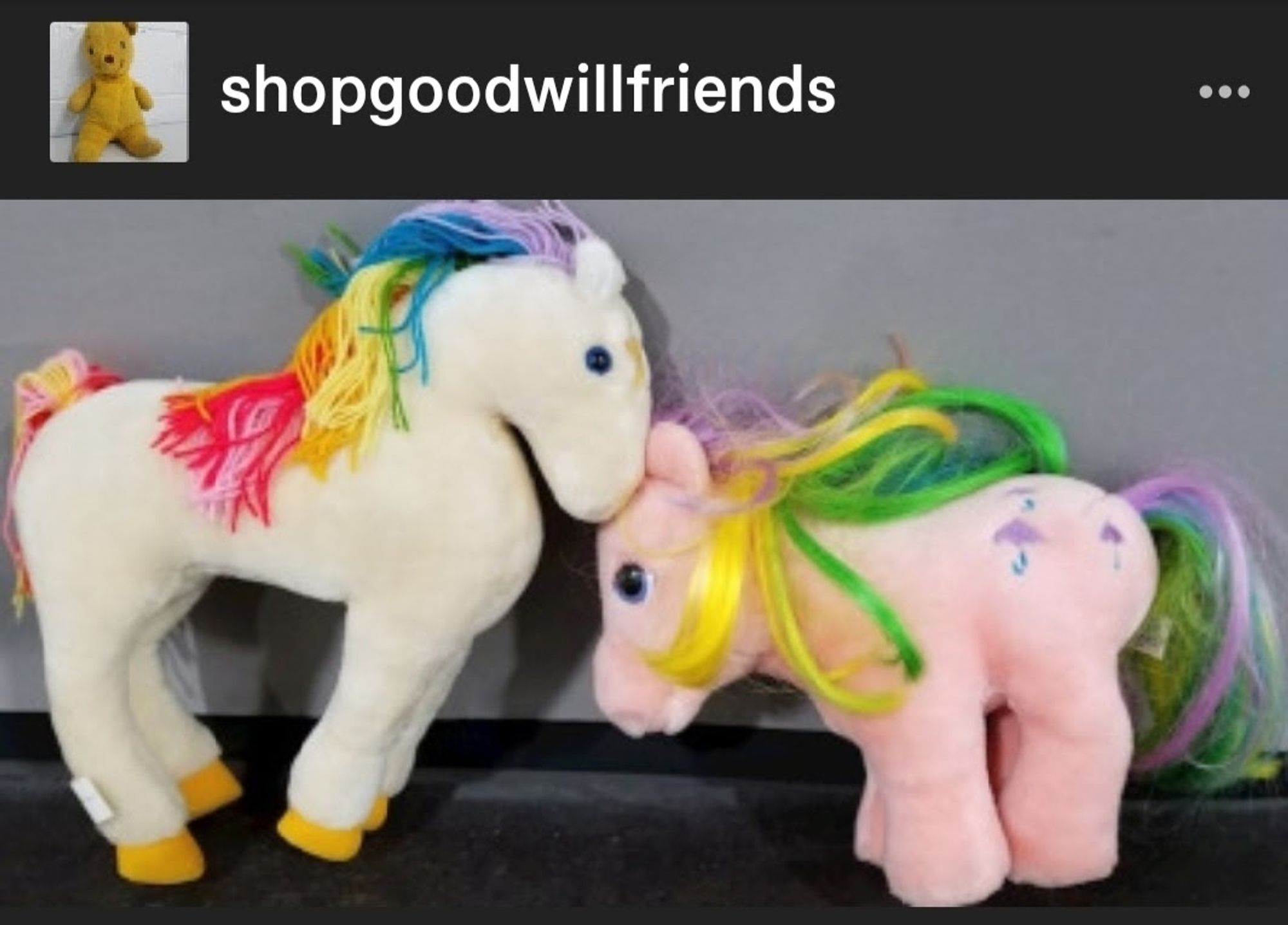 A photo of 2 vintage plushies. On the left is Starlite from Rainbow Brite (a white horse with a rainbow mane). On the right is Parasol from My Little Pony (a pink Pony with a rainbow mane)