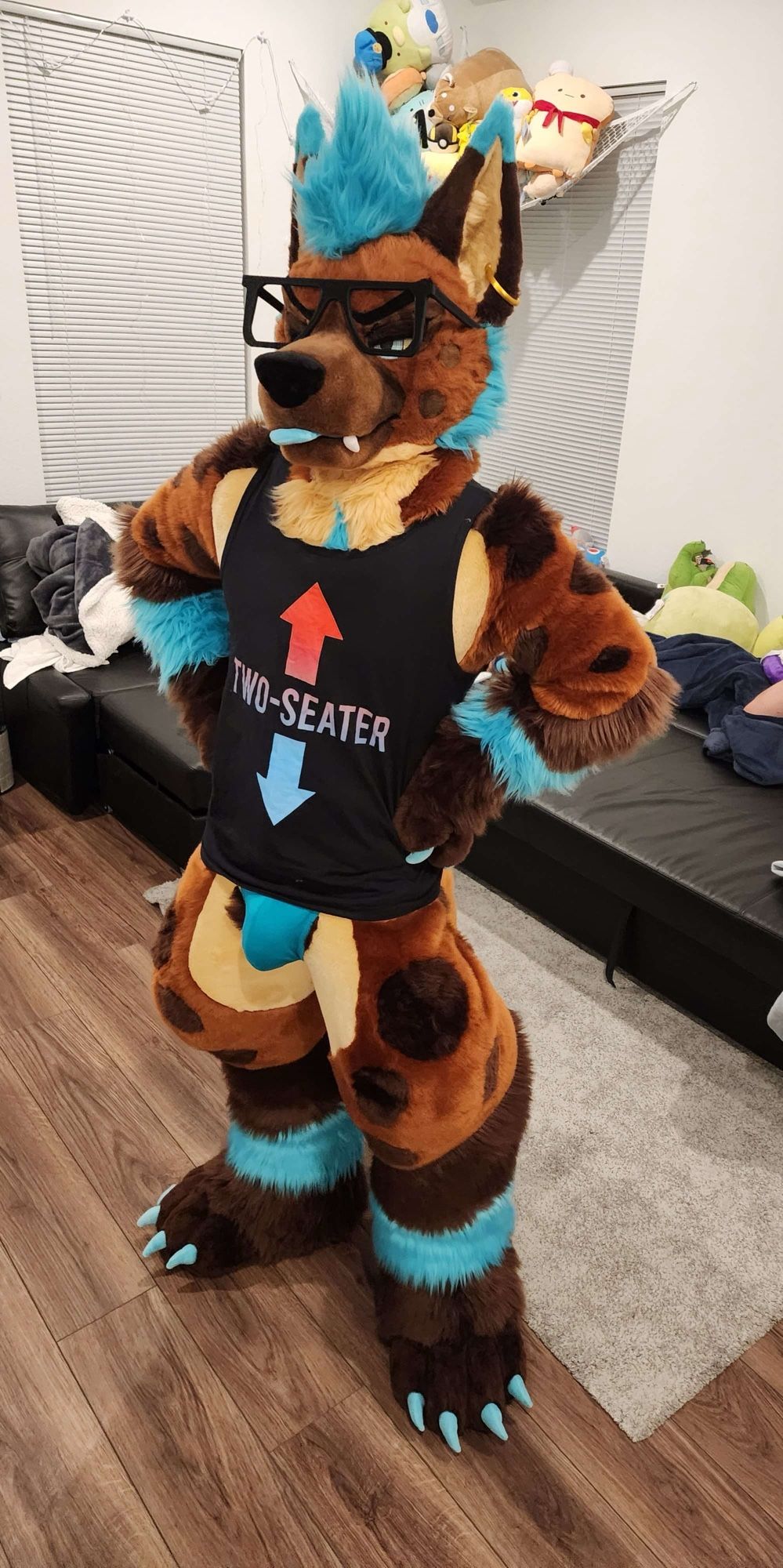 Juiceps in fursuit wearing underwear and a tank top with the text “two-seater” with arrows pointing at the face and crotch.