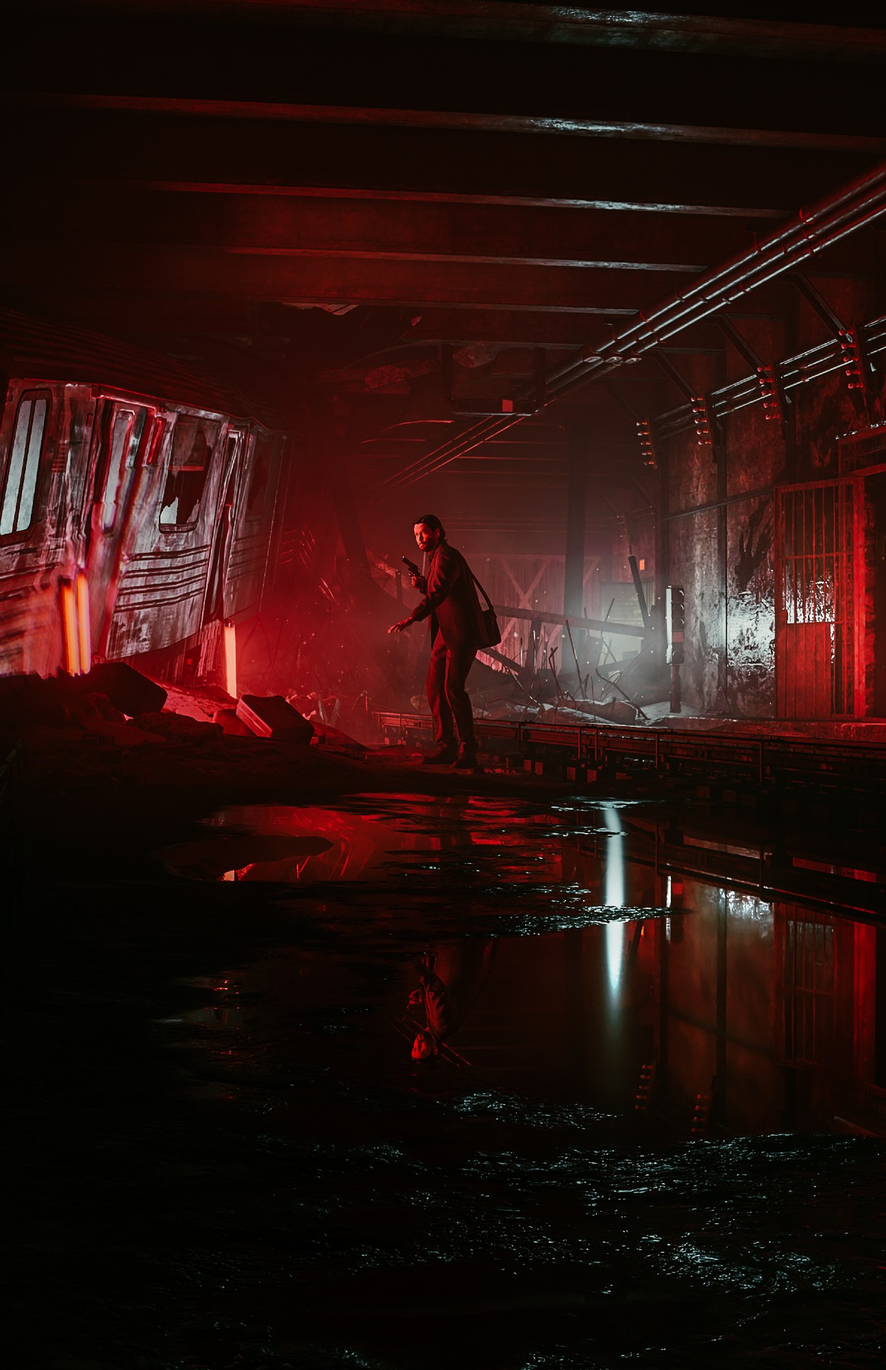 Alan Wake stood in the centre of a beaten up looking subway station, red light glows brightly from strip lights leaning against a derailed train car