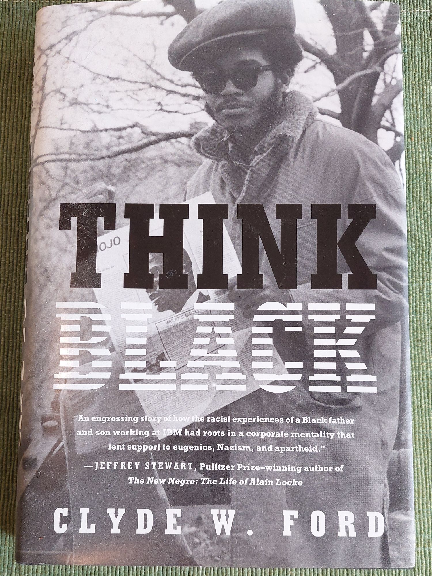 Cover of the book Think Black by Clyde Ford, about, among many other things, IBM's role in supporting "eugenics, Mazism, and apartheid. Photo of the author as a young man in the '70s with shades,  Afro, muttonchops and a porkpie hat.