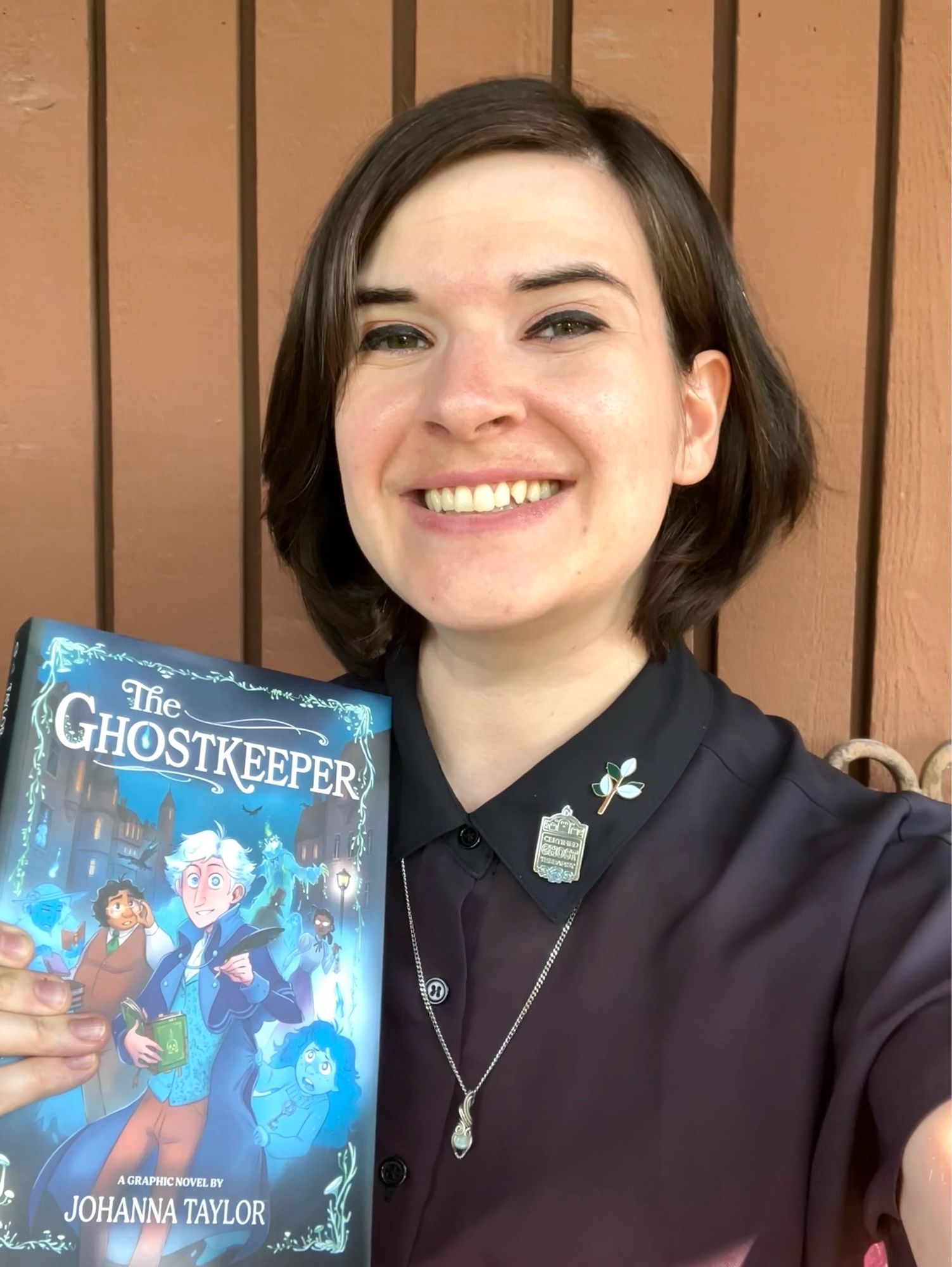 Me holding a copy of THE GHOSTKEEPER