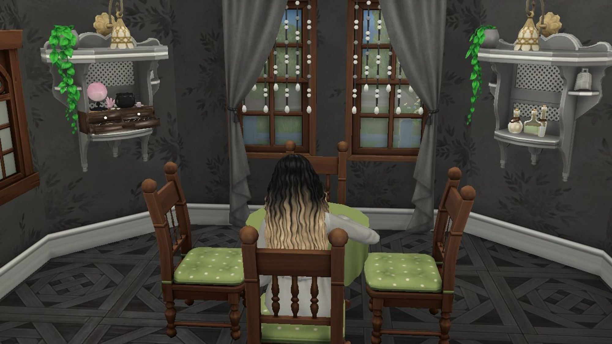 Luna sits alone at her dining room table eating while wearing a gray robe.