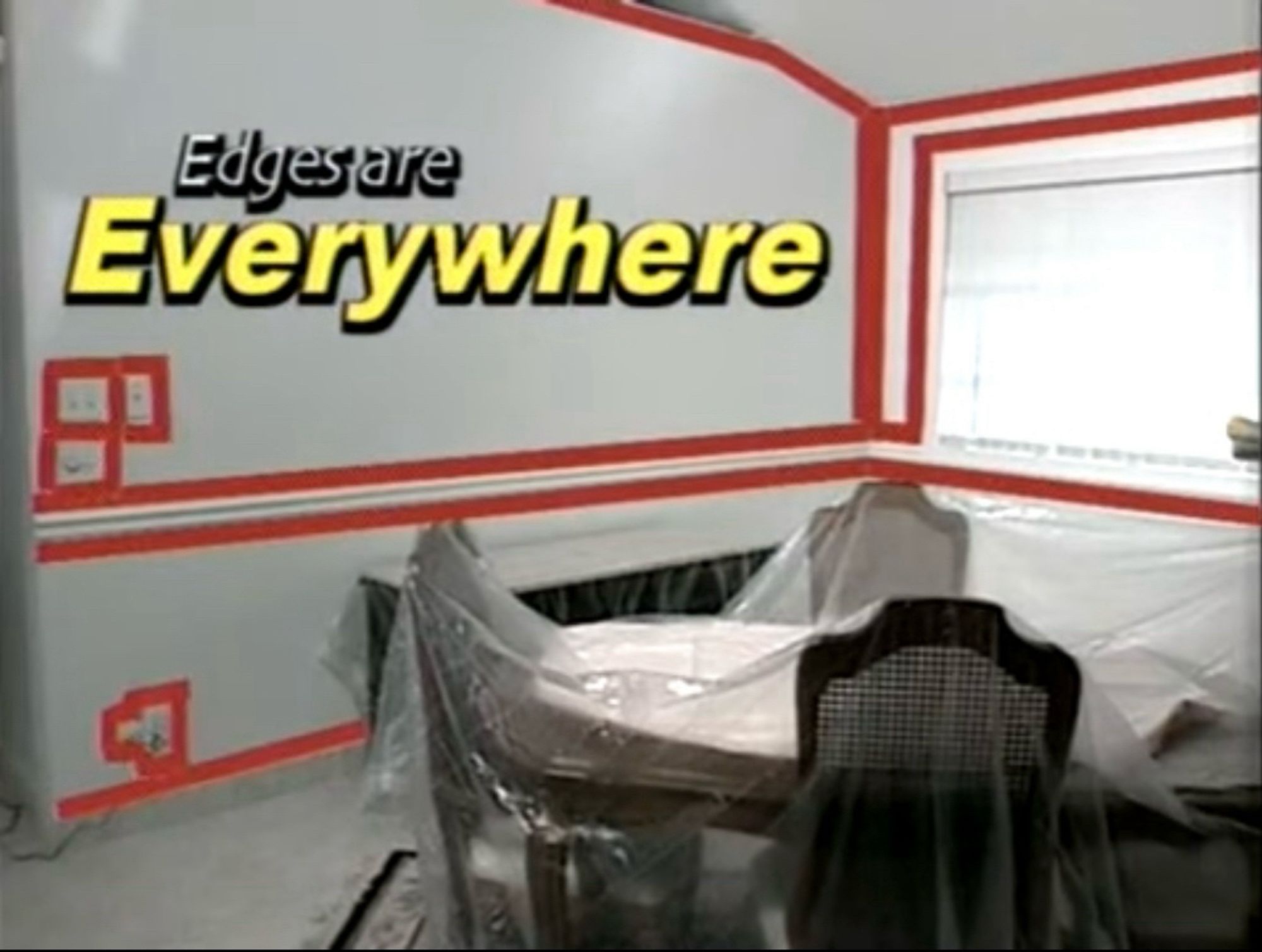 a room with red tape on the walls with text "edges are everywhere"