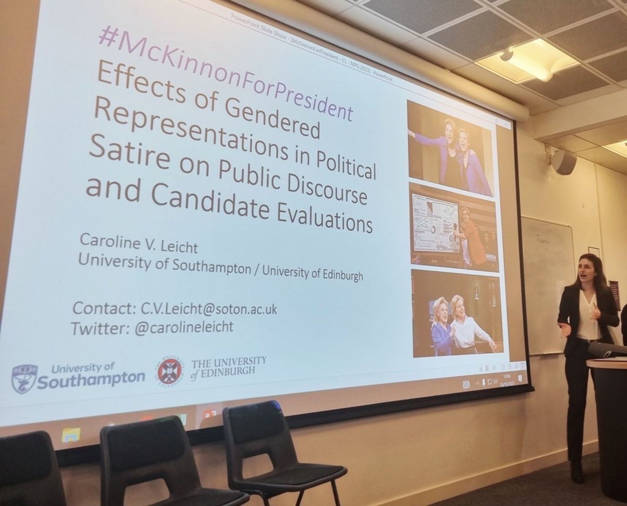 Caroline standing next to a large screen and talking. The slide says "#McKinnonForPresident: Effects of Gendered Representations in Political Satire on Public Discourse and Candidate Evaluations. Caroline V. Leicht. University of Southampton/University of Edinburgh." The slide also shows Caroline's contact information and three screenshots from Saturday Night Live featuring Kate McKinnon, Elizabeth Warren and Hillary Clinton.