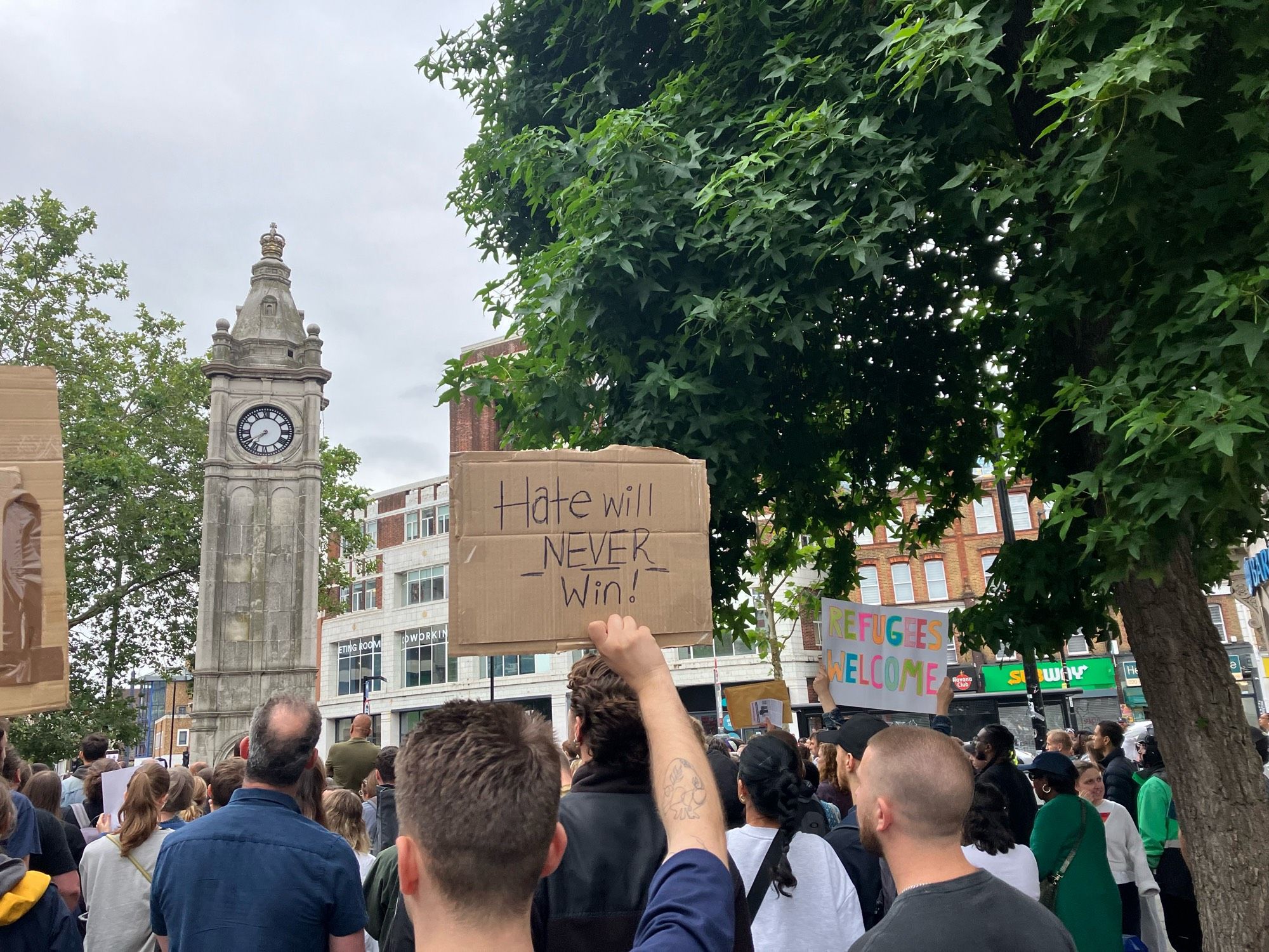 Hate will never win placard at demo