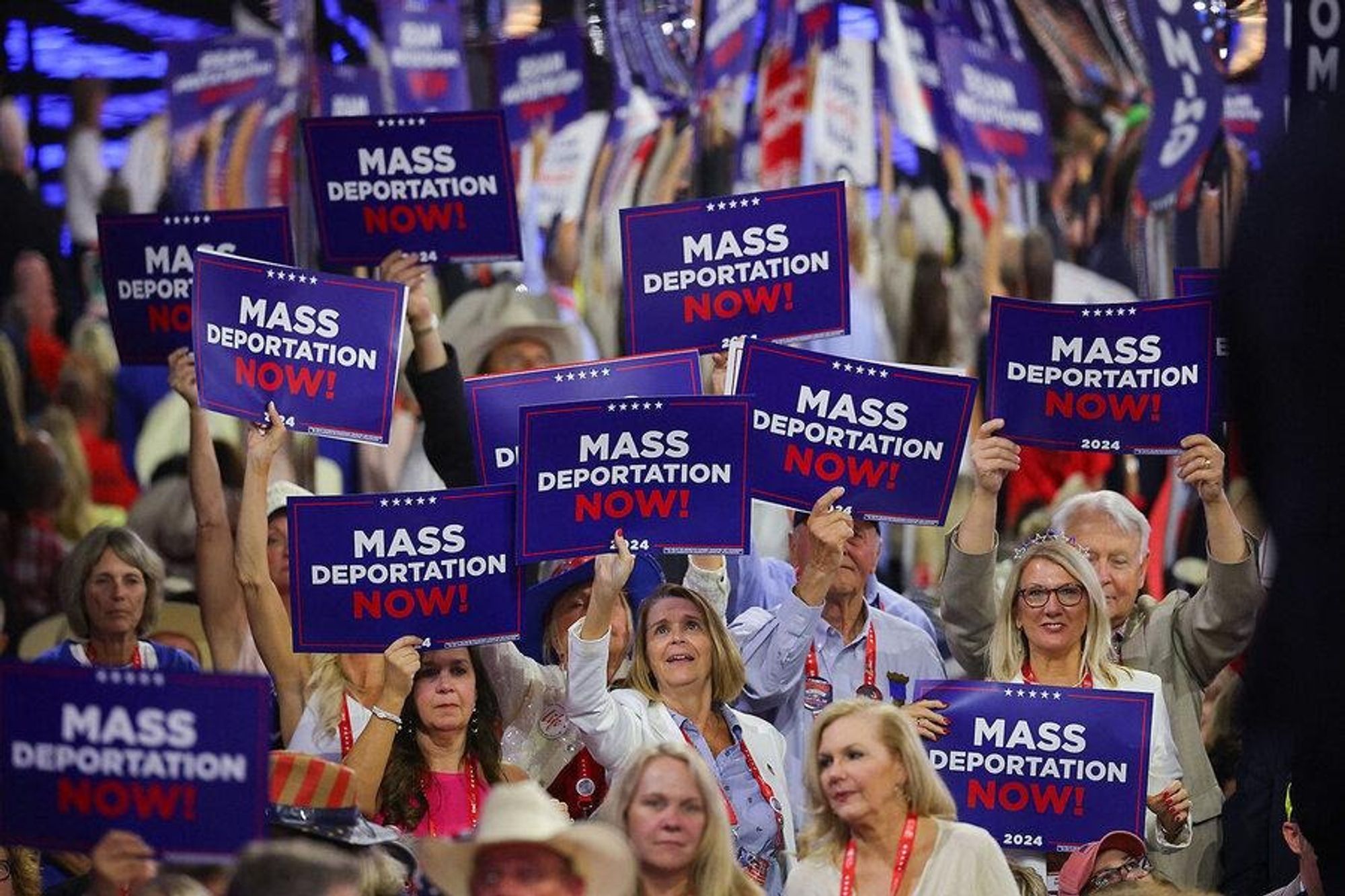 A picture of "MASS DEPORTATION NOW!" signs at the RNC