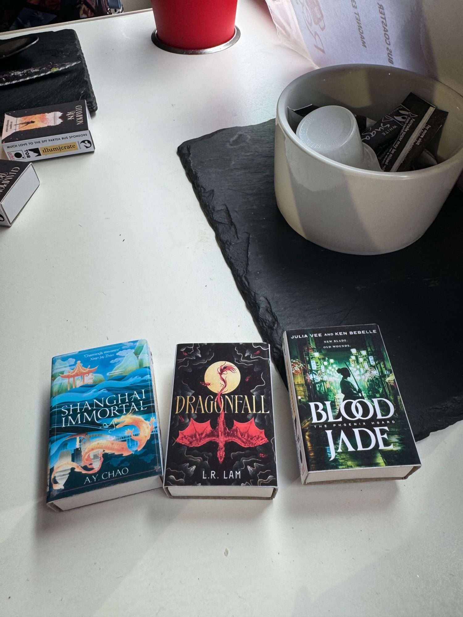 Miniature matchbox sized books of Shanghai Immortal, Dragonfall and Blood Jade