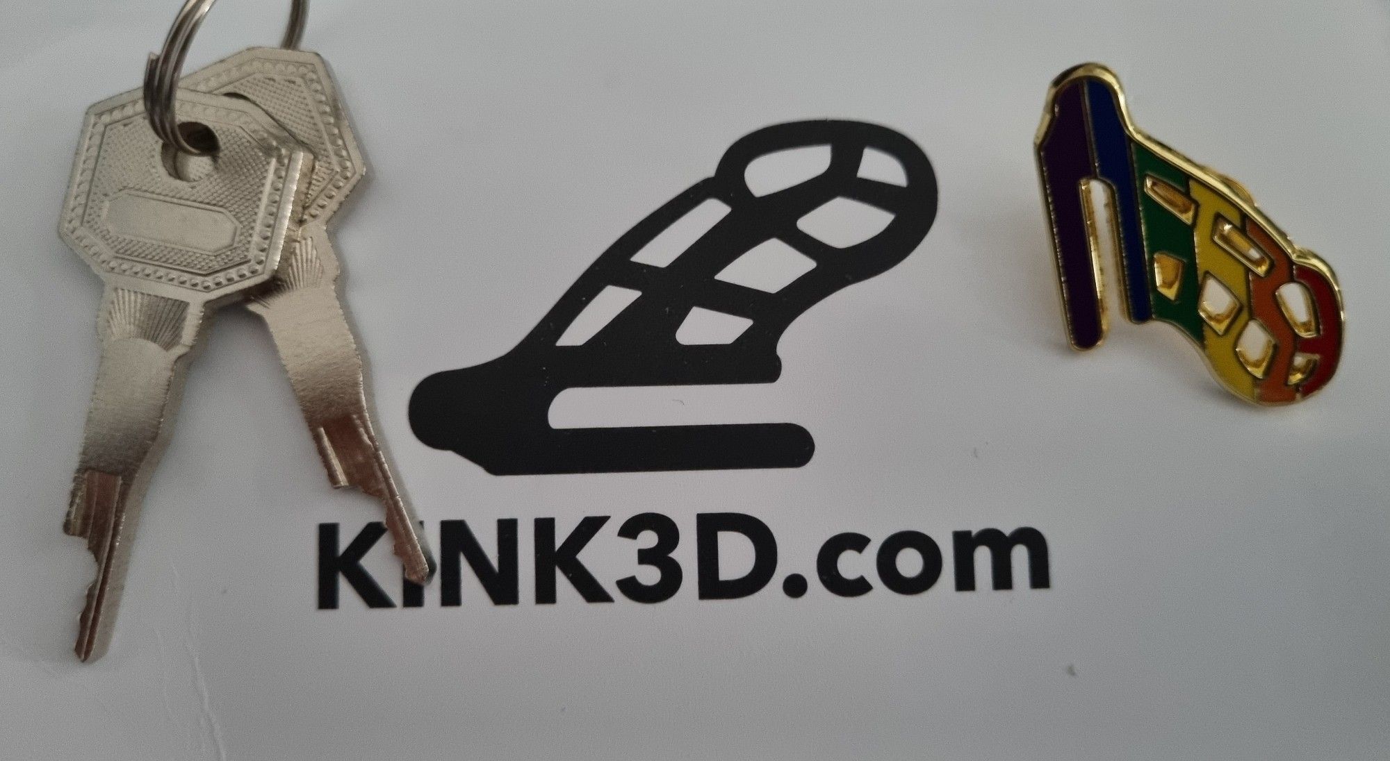 Chastity keys against the Kink3D logo