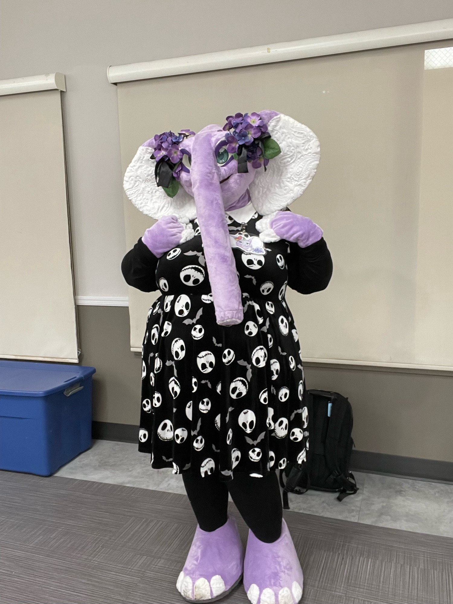 Lavender in a black dress with jack skellington faces, in a cute pose