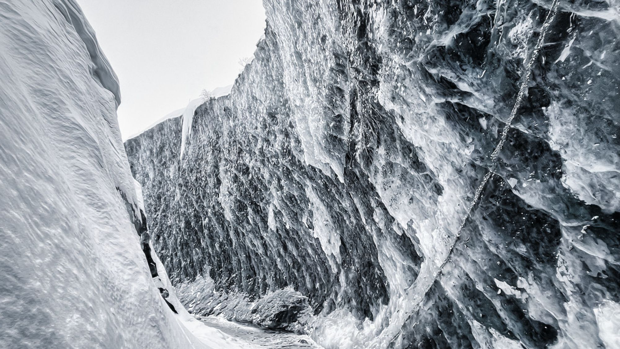 Patterns created through a deep ice crevasse in an Alaskan glacier