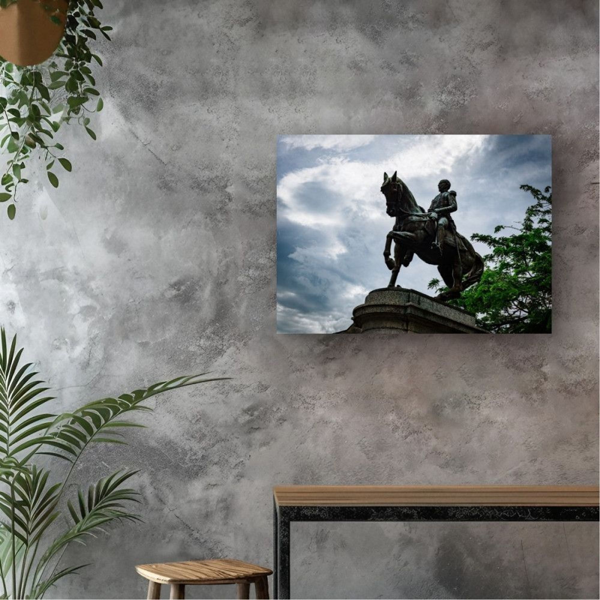 Statue of a Panama general and his horse set off against dramatic clouds 