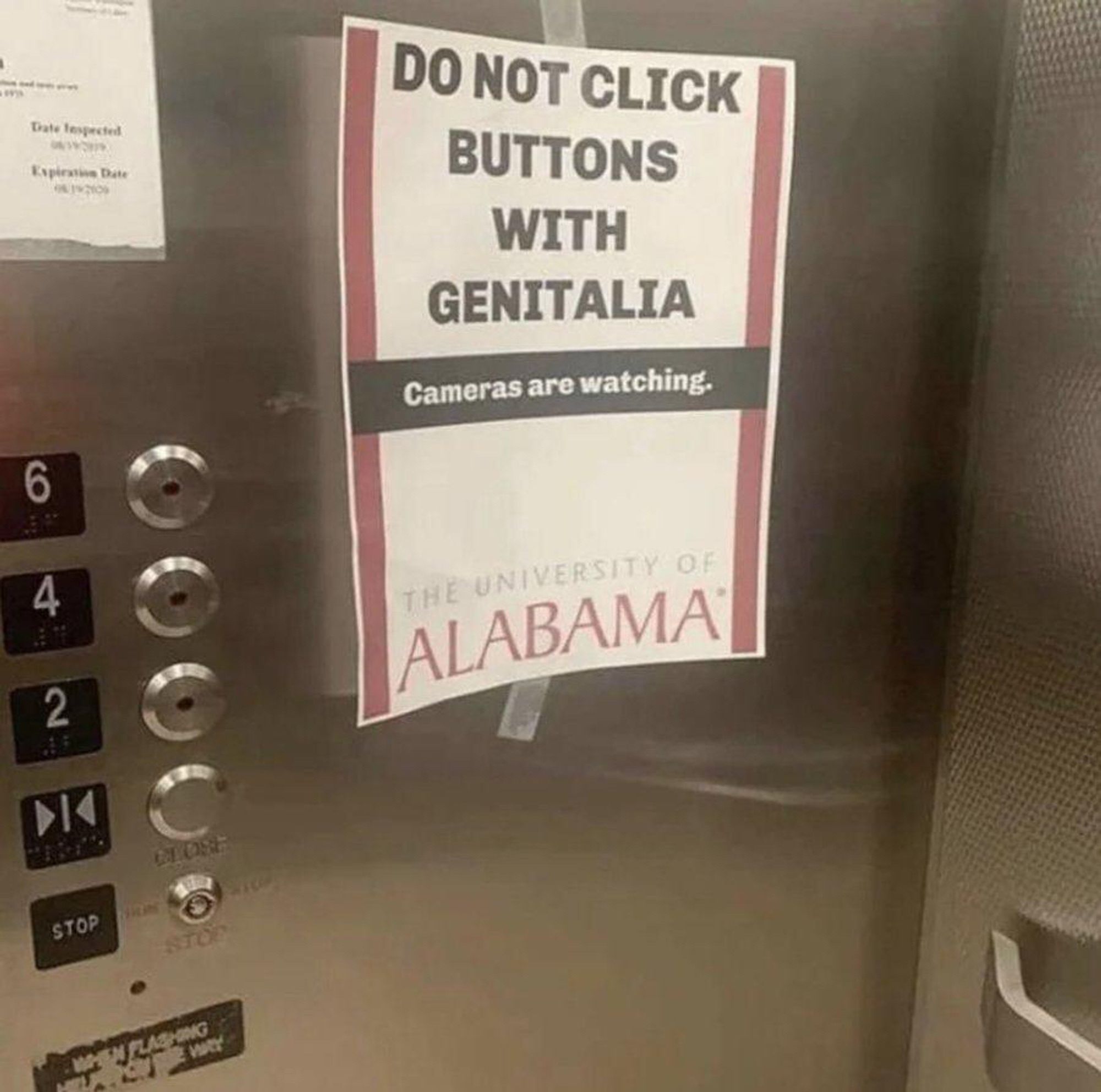 A sign posted in an elevator at the University of Alabama’s Gorgas Library four years ago. It reads “Do not click buttons with genitalia. Cameras are watching.”