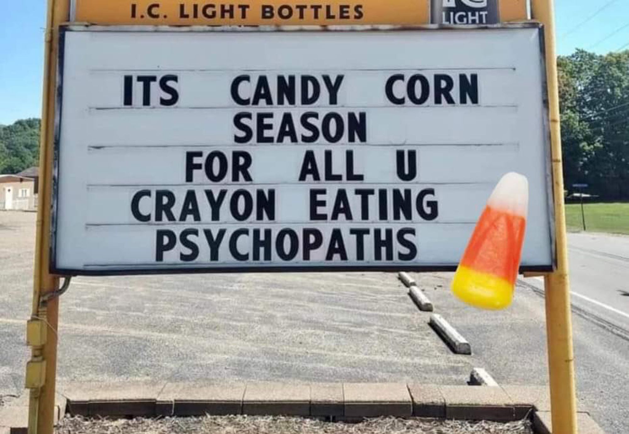 Sign reading “It’s candy corn season for all U crayon eating psychopaths.”