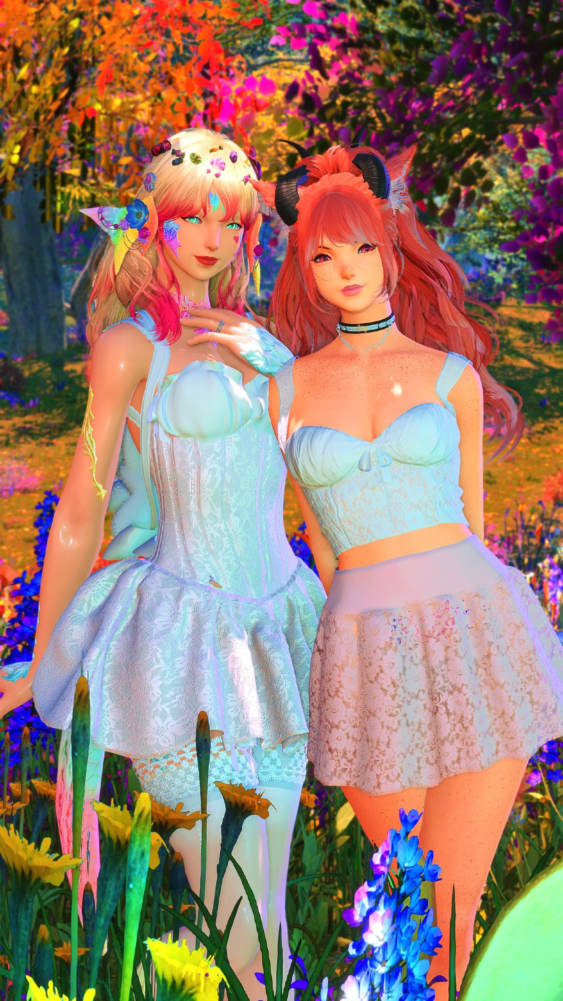 A photo of me and my girlfriends Final Fantasy XIV characters in a forest with multi colored f lowers and tree leaves. My character is a female Au'Ra with blonde hair and pink highlights. She has rainbow colored scales & is wearing a white lace dress. Sabby is a female Miqo'te with pink hair, and wearing a white short cut top and pink lace skirt