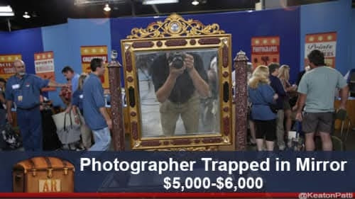 A mirror in which you can see the photographer. Caption: photographer trapped in mirror. $5,000-$6,000