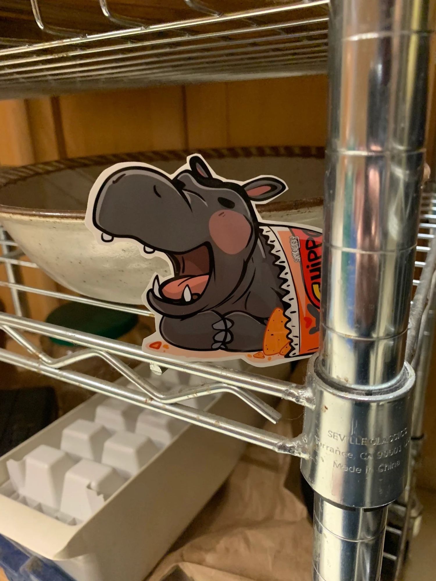 the tiny hippo is hiding in the dishracks.