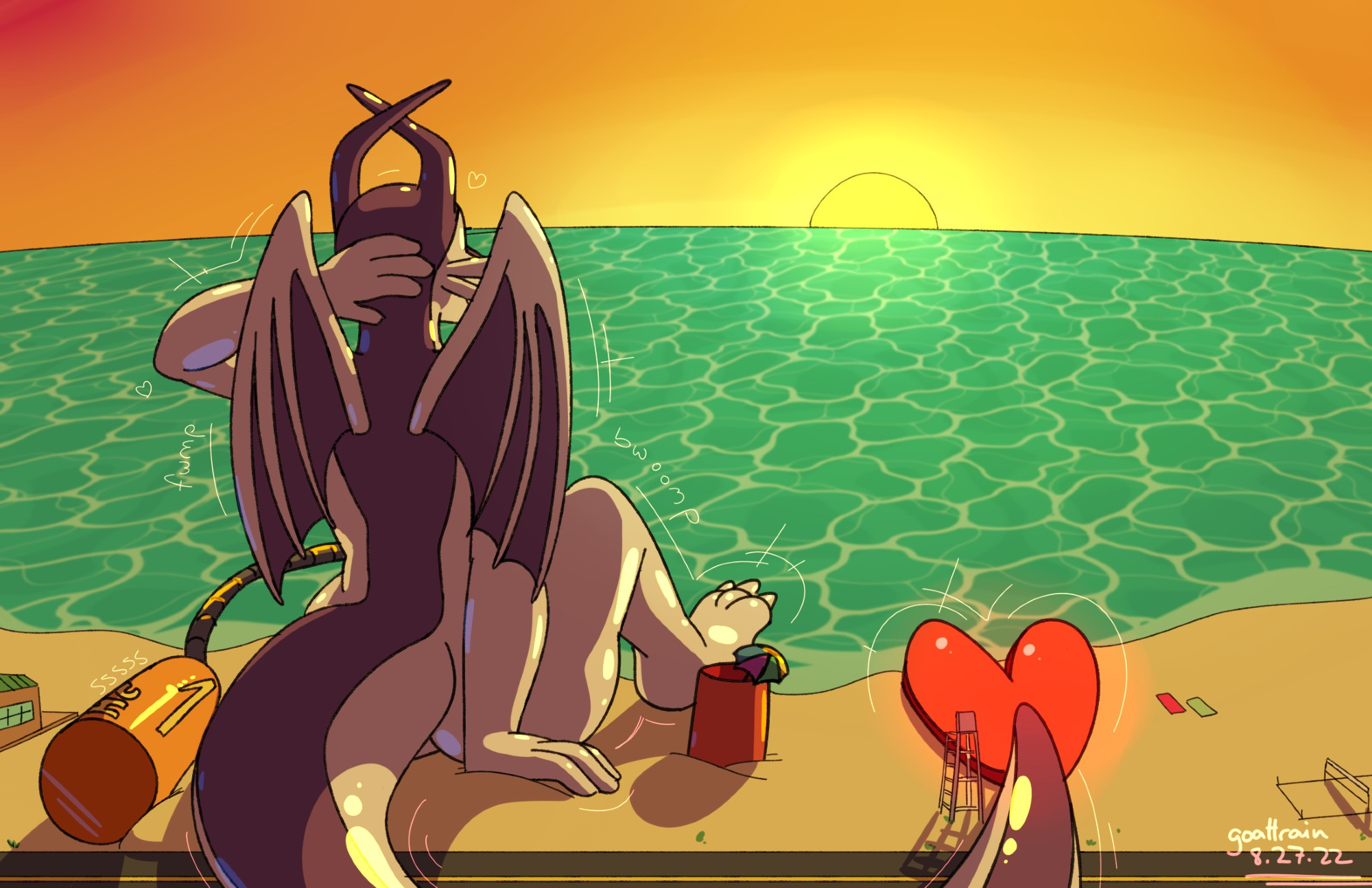 a giant pooltoy resting on the beach at sunset