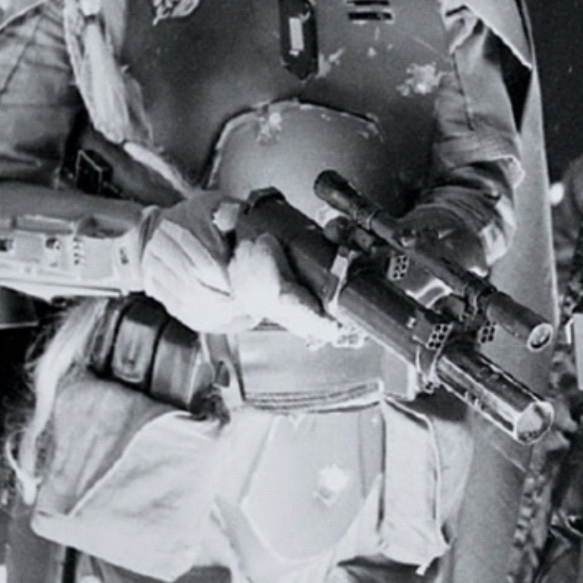 B&W production still of Boba holding his EE-3