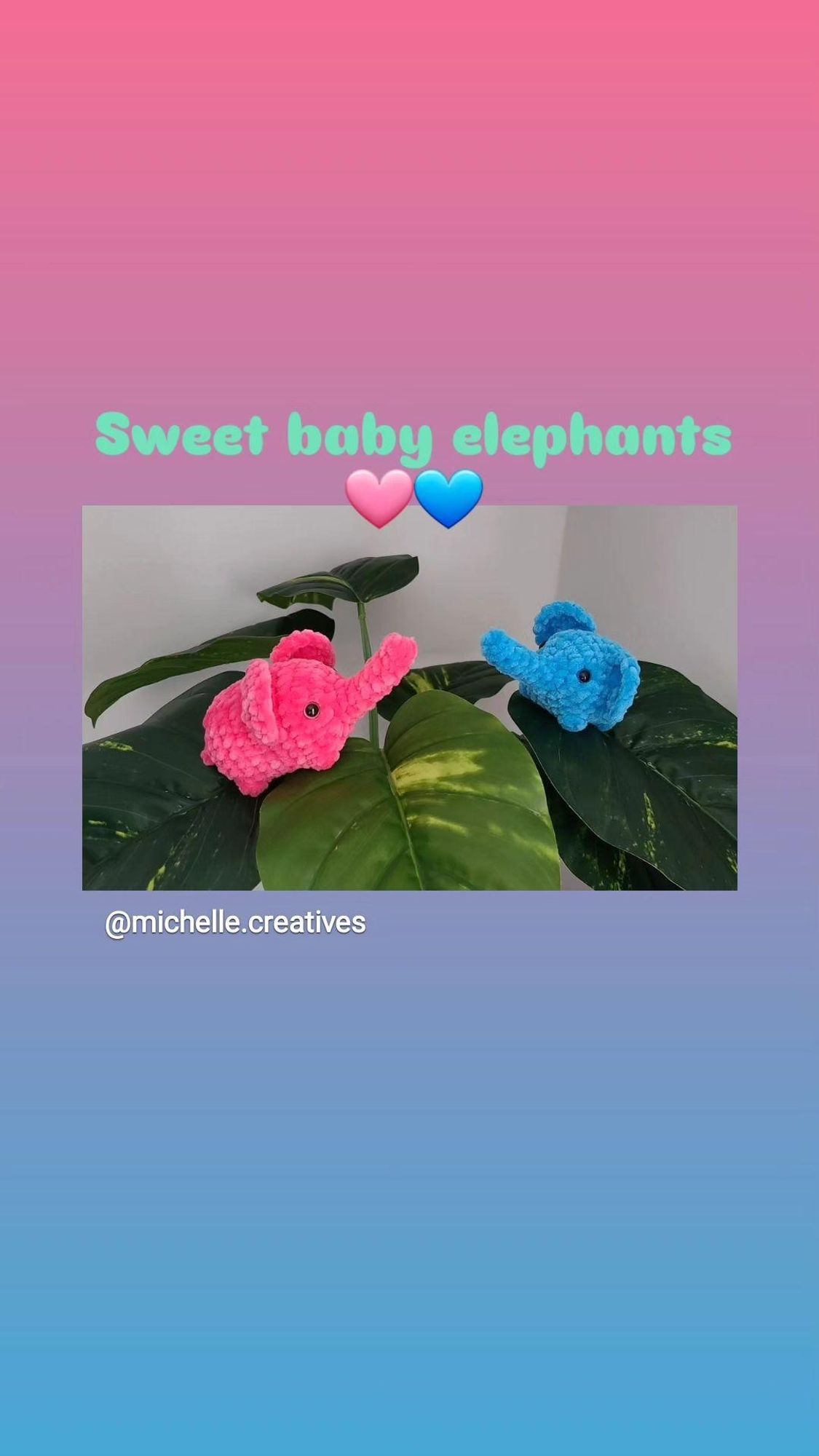 2 amigurumi elephants, 1 pink and 1 blue, on the leaves of a houseplant