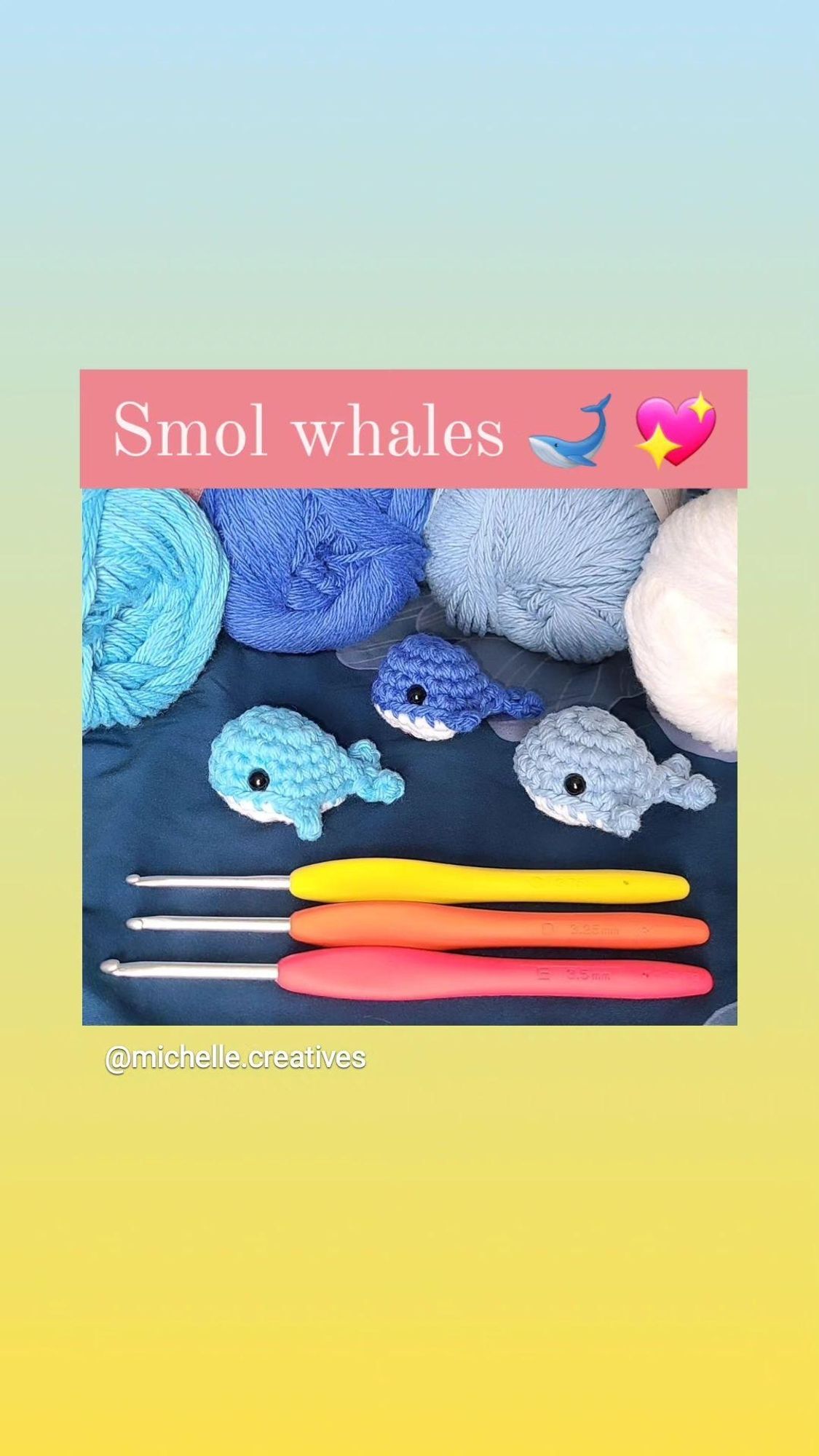 3 tiny amigurumi whales, all a different shade of blue with white bellies