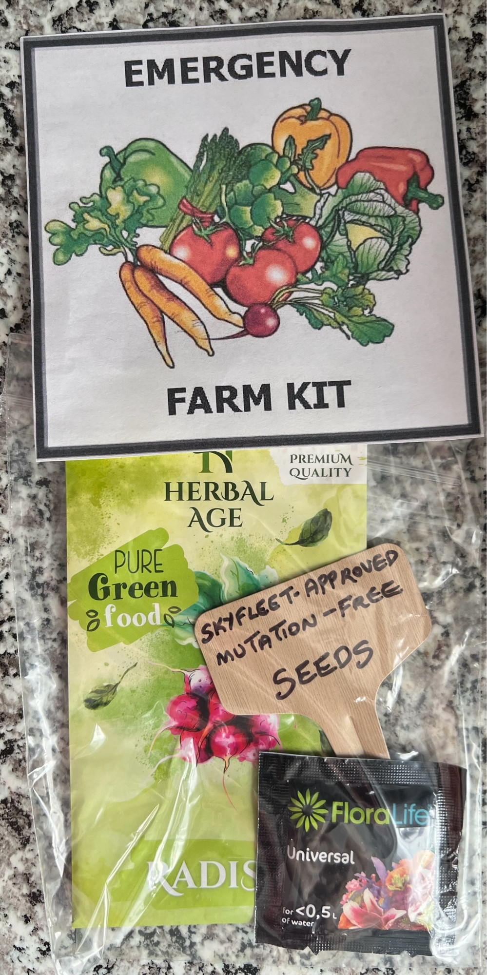 Emergency farm kit sign, a herbal tea bag, some plant seeds and a sign saying “Skyfleet approved mutation - free. seeds.”