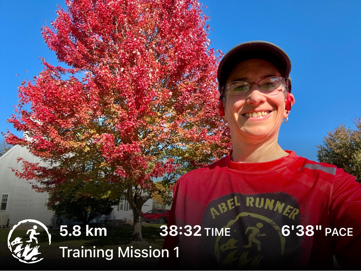 Selfie in my Abel Runner shirt in front of a big beautiful maple turned bright red. The sky is clear blue
5.8 km 38:33 time 6’38” pace