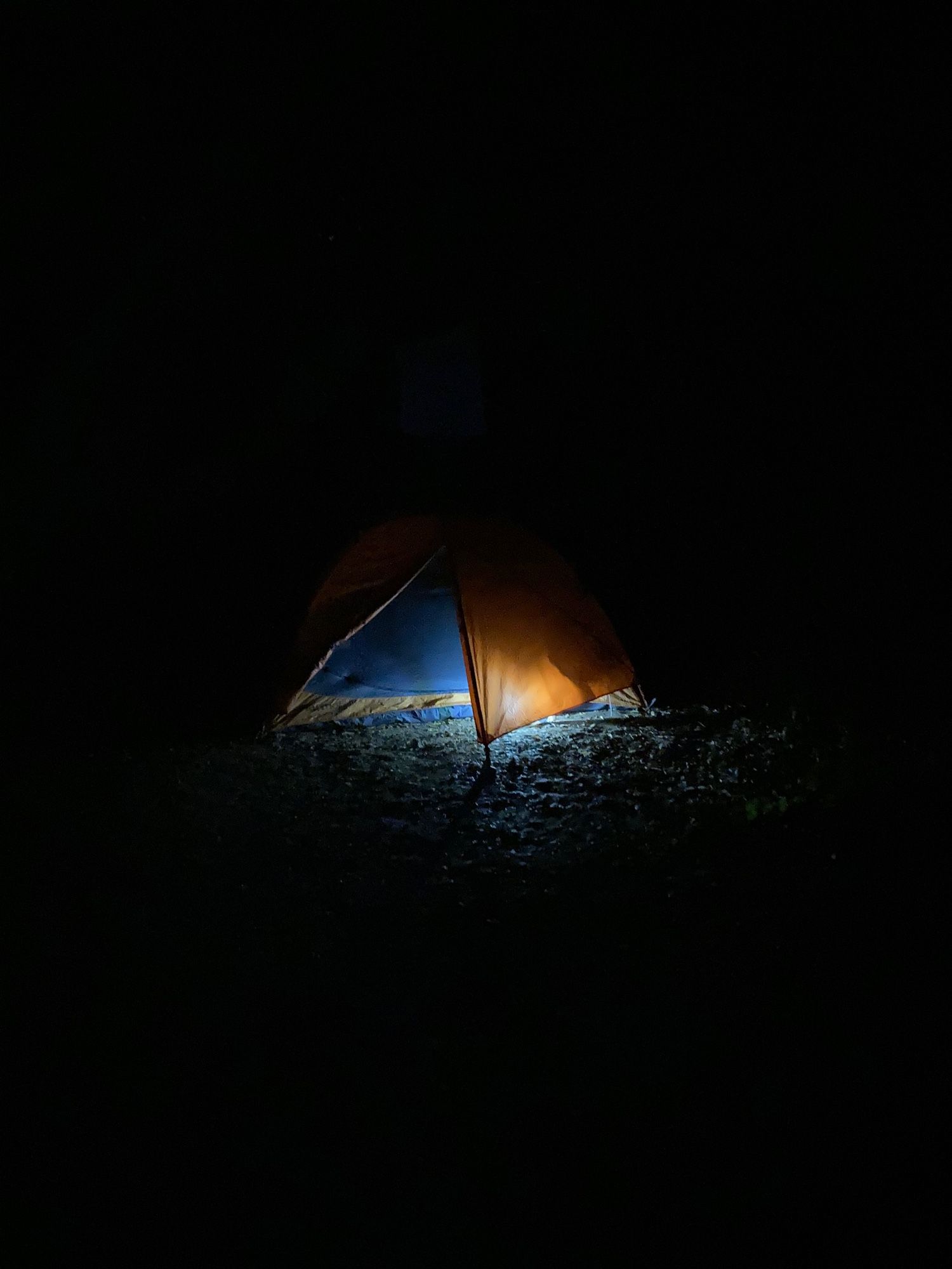 Tent illuminated by lantern