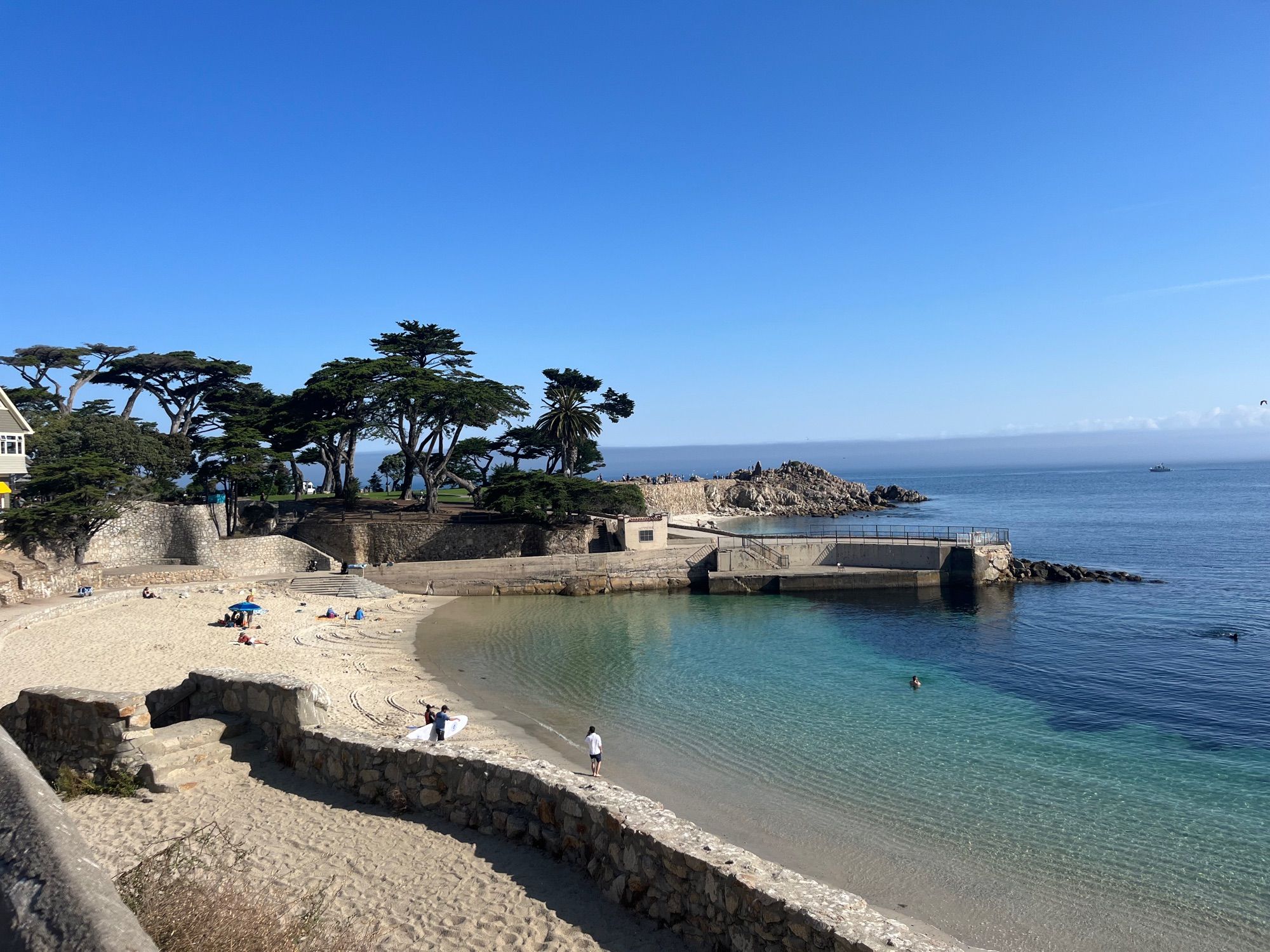 Blue ocean water and a sandy beach near Lovers Point in Pacific grove, CA