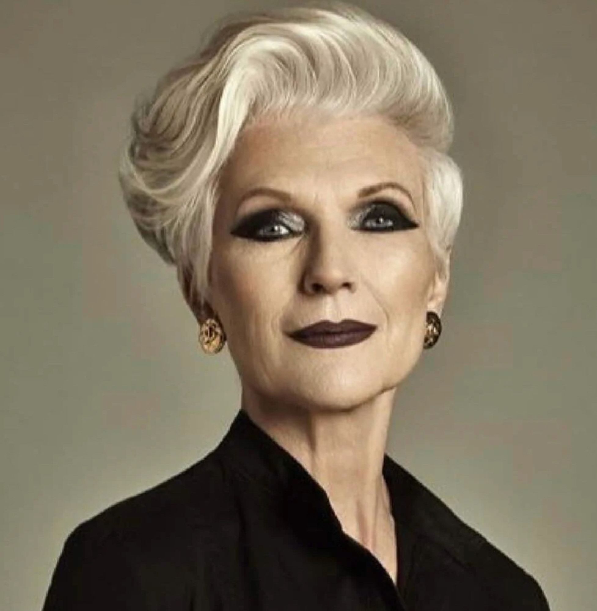 Headshot of Elon Musk's ma. She looks harsh and somewhat futuristic. Her silver hair is swept across her head like a crashing wave and she's wearing enough makeup for three women, each of whom wears too much makeup.