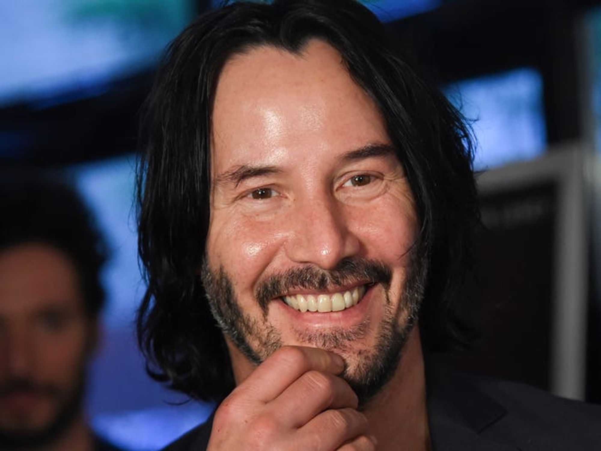 Keanu Reeves smiling.