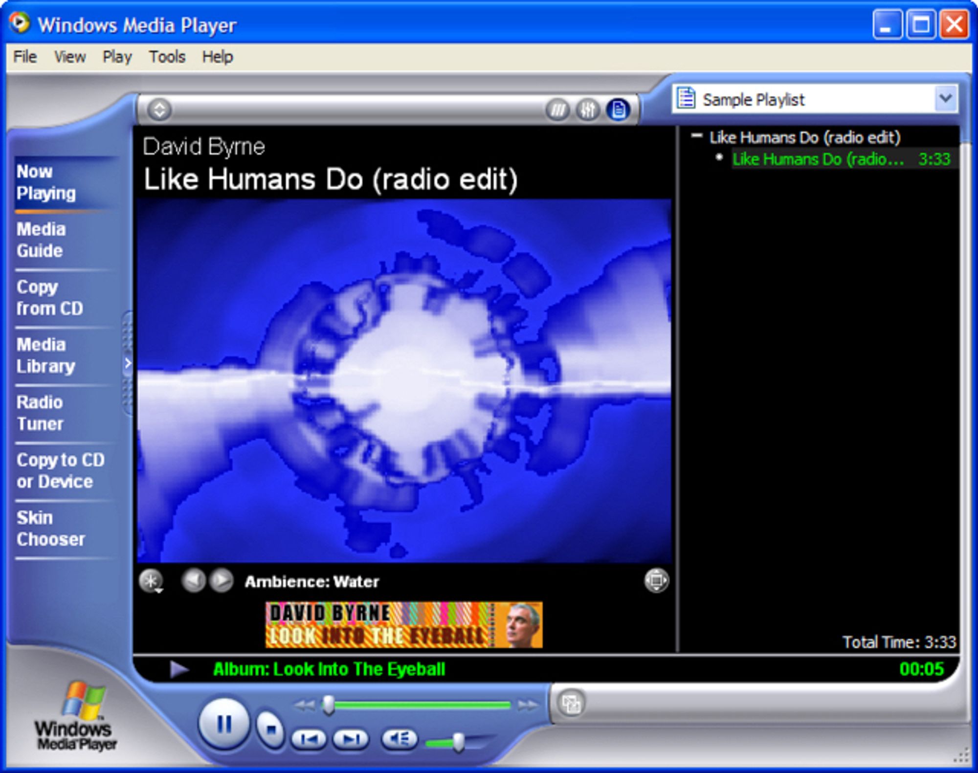 Screencap of the lovely chunky ui of the windows media player and its blue and white visualizer