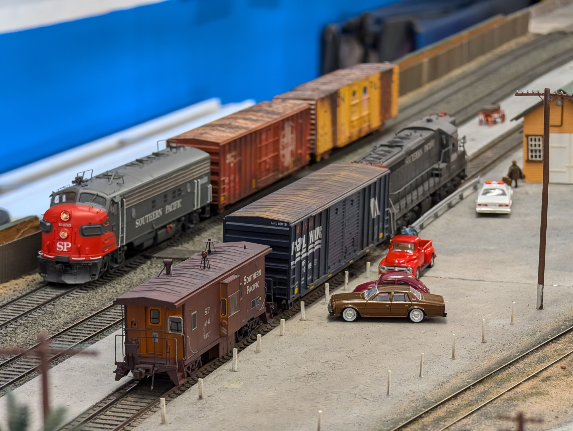 Southern Pacific grey and red diesels pass each other 