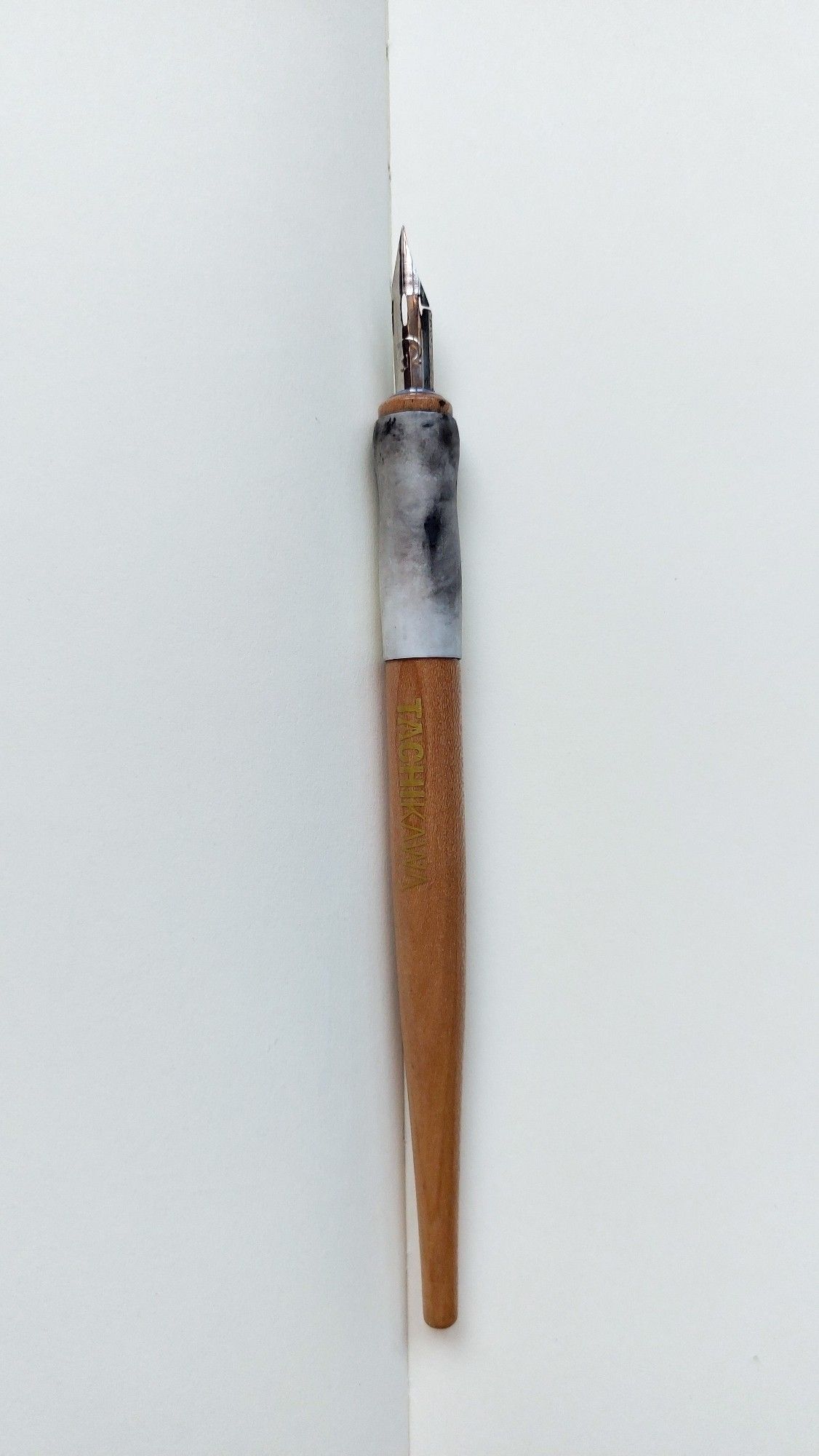 Photo of an ink-stained dip pen