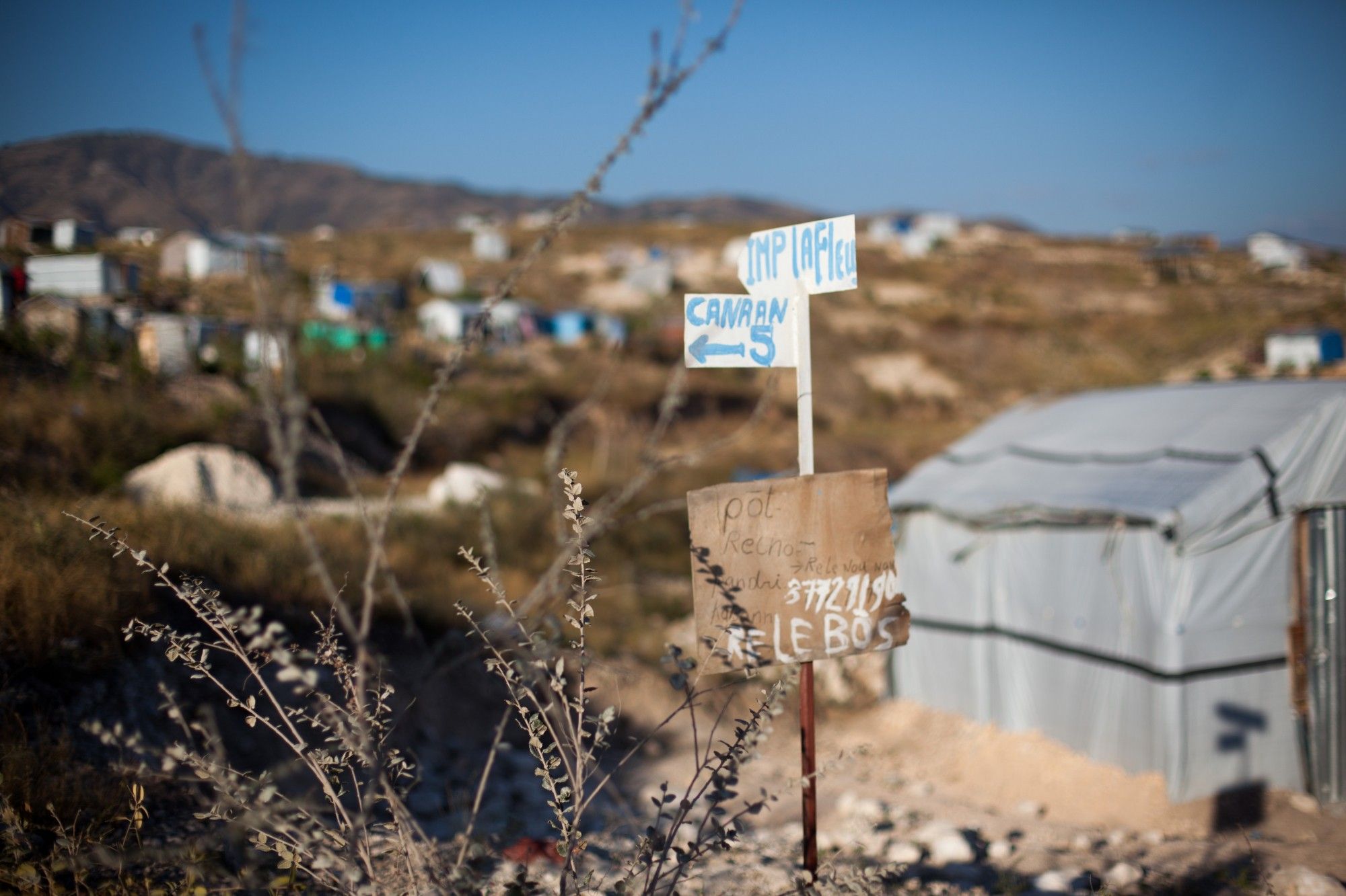 A handmade sign directs visitors within the Canaan settlement, Feb. 21, 2011. The hilly settlement is divided into numbered sections accessible by dirt paths.