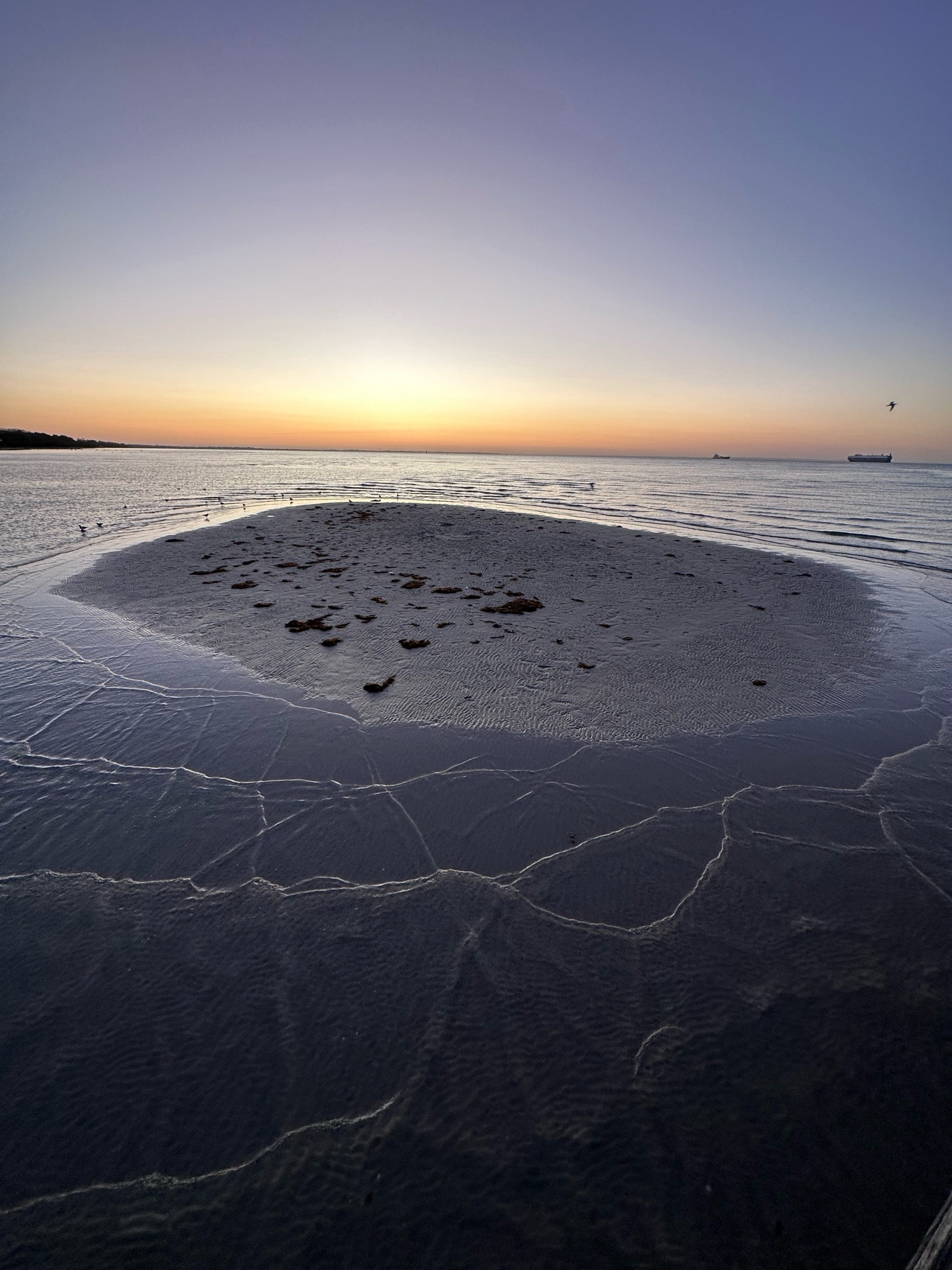 Sand island at sunset